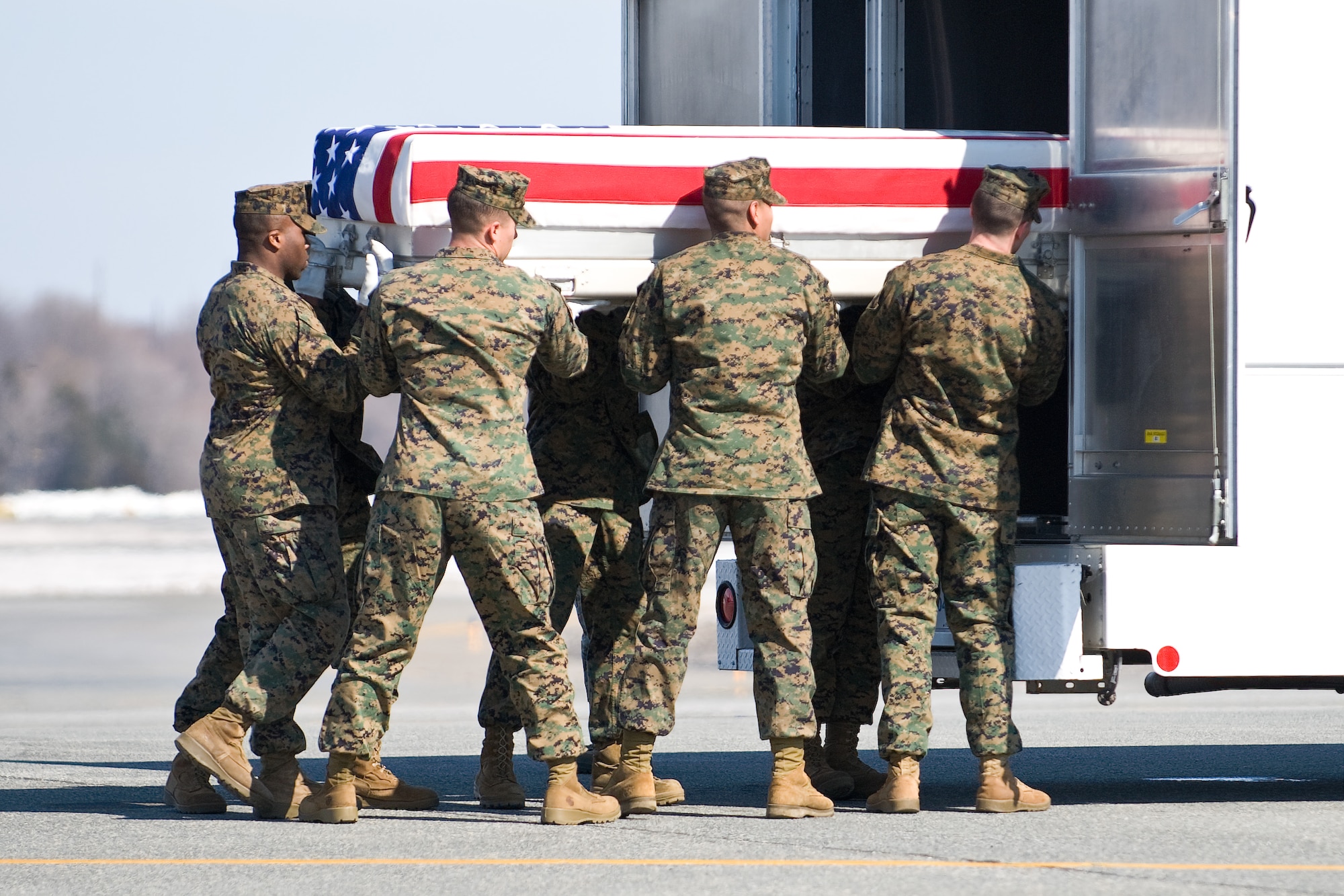 A U.S. Marine Corps team transfers the remains of Marine Corps Lance Cpl. Kielin T. Dunn, of Chesapeake, Va., at Dover Air Force Base, Del., February 20. Lance Cpl. Dunn was assigned to 1st Battalion, 6th Marine Regiment, 2nd Marine Division, II Marine Expeditionary Force, Camp Lejeune, N.C. (U.S. Air Force photo/Roland Balik)