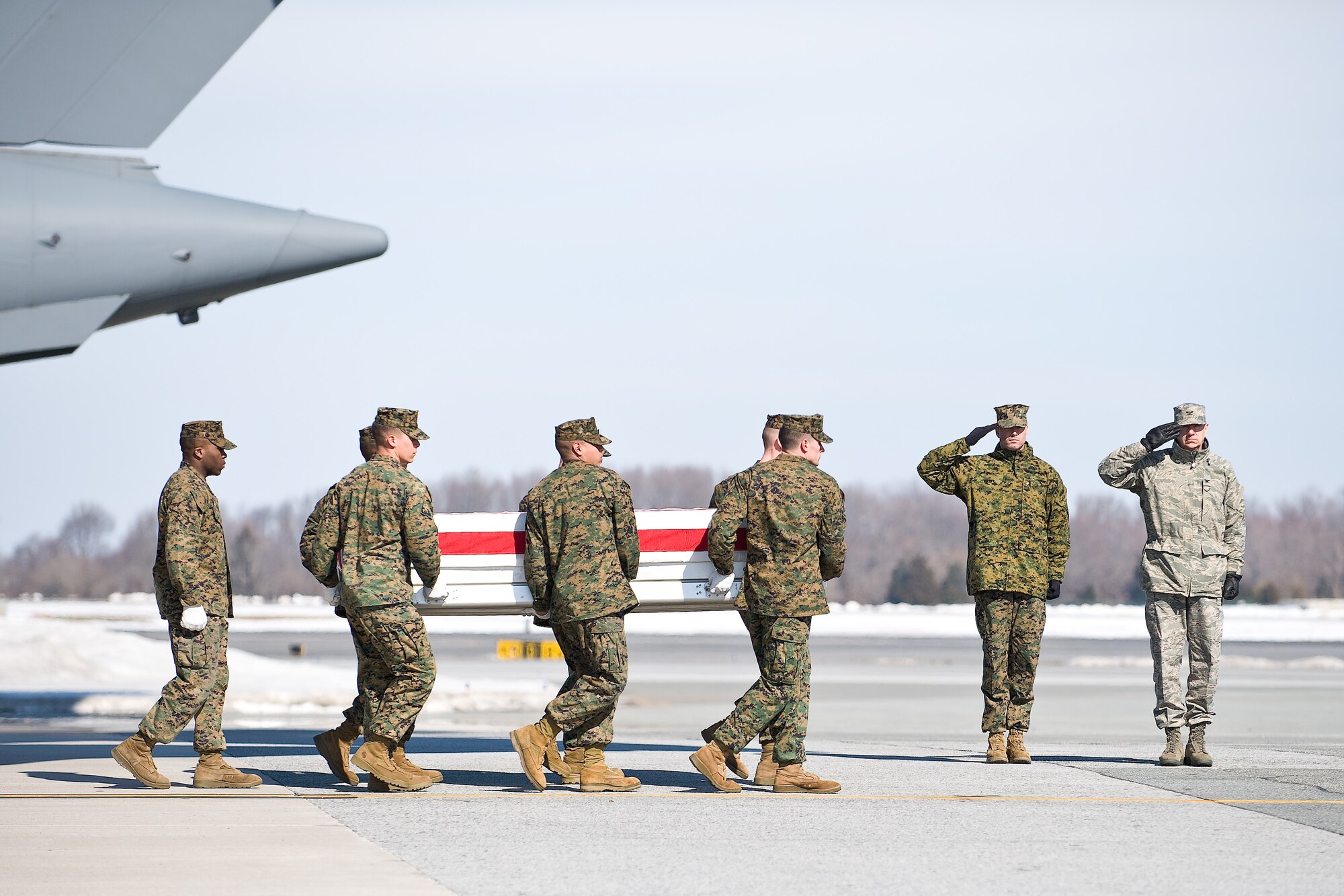 A U.S. Marine Corps team transfers the remains of Marine Corps Sgt. Jeremy R. McQueary, of Columbus, Ind., at Dover Air Force Base, Del., February 20. Sgt. McQueary was assigned to 2nd Combat Engineer Battalion, 2nd Marine Division, II Marine Expeditionary Force, Camp Lejeune, N.C. (U.S. Air Force photo/Roland Balik)