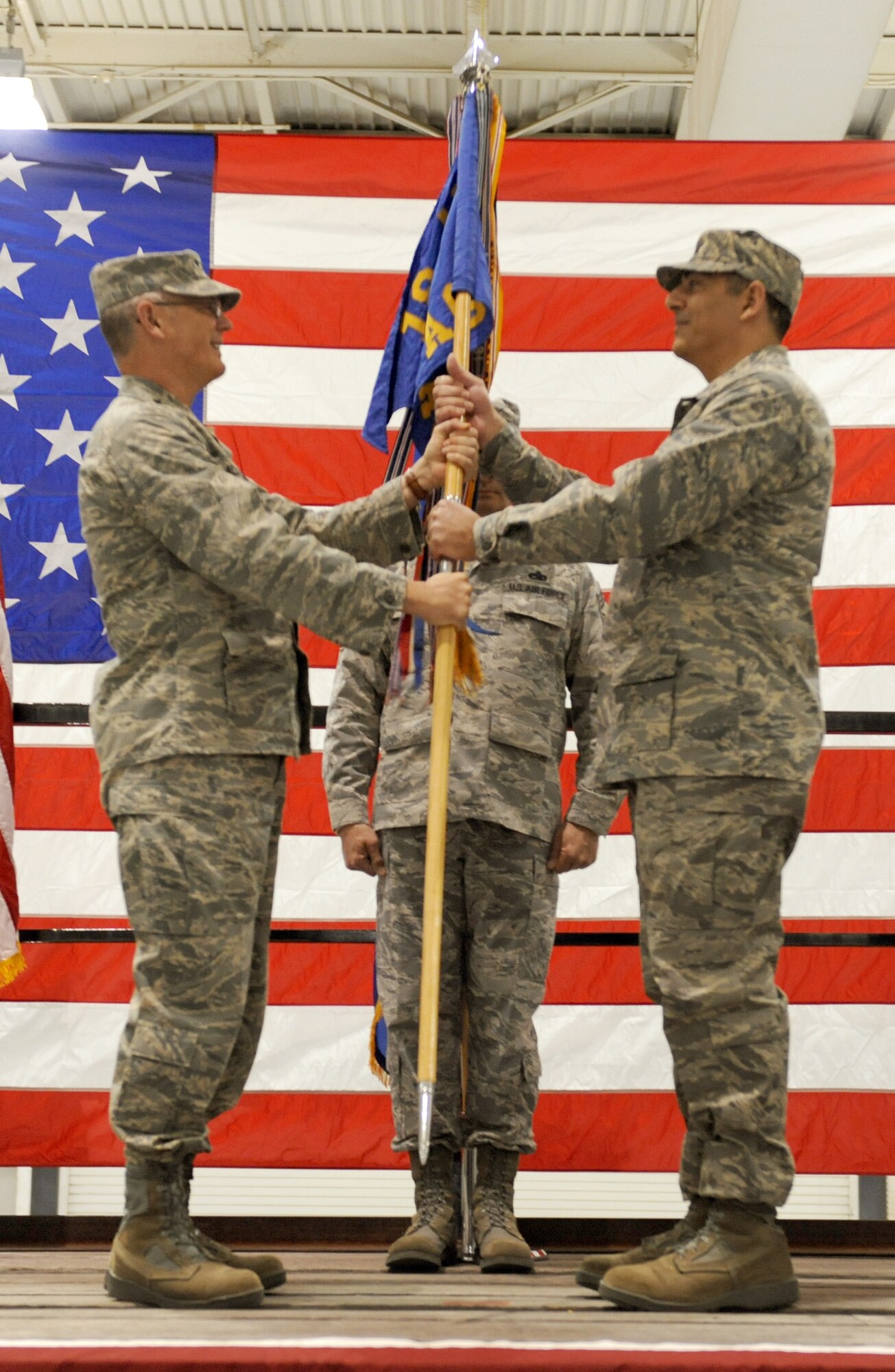 DYESS AIR FORCE BASE, Texas – Col. Dan Dagher assumes command of the 317th Airlift Group from Col. Bernard E. Mater here Dec. 21. Lt. Gen. Robert R. Allardice, 18th Air Force Commander presided over the ceremony. 