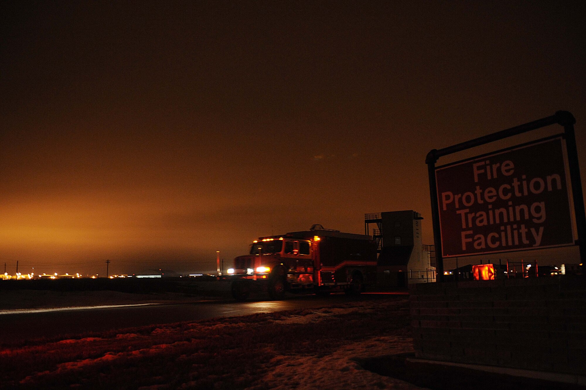 ELLSWORTH AIR FORCE BASE S.D.-- Members of the 28th Civil Engineer Squadron's fire protection flight head to the fire station after a night structural fire training exercise, Feb. 17. The simulated structural fires allow firefighters to safely practice extinguishing fires to maintain operational readiness. (U.S. Air Force photo/Airman 1st Class Corey Hook)