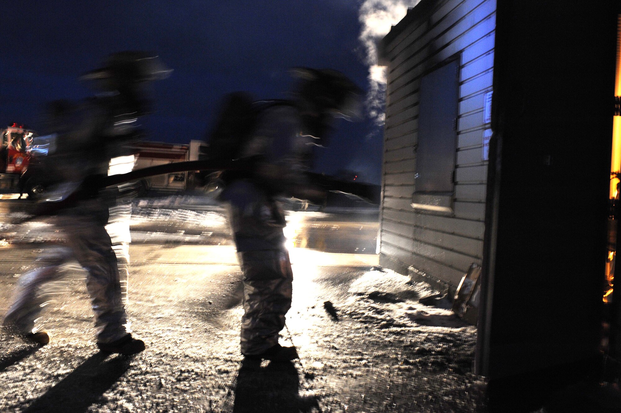 ELLSWORTH AIR FORCE BASE, S.D.--  28th Civil Engineer Squadron firefighters conduct a night structural fire training exercise, Feb. 17. Ellsworth’s fire department trains every day to respond to emergencies. (US Air Force photo/Airman 1st Class Corey Hook)