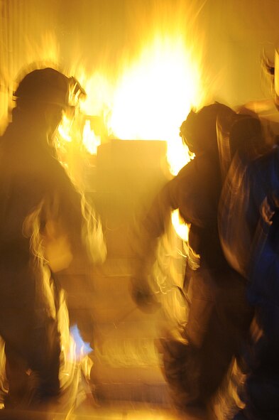 ELLSWORTH AIR FORCE BASE, S.D. -- 28th Civil Engineer Squadron firefighters conduct a night structural fire training exercise, Feb. 17. The simulated structural fires allow firefighters to safely practice extinguishing fires to maintain operational readiness. (U.S. Air Force photo/Airman 1st Class Corey Hook)