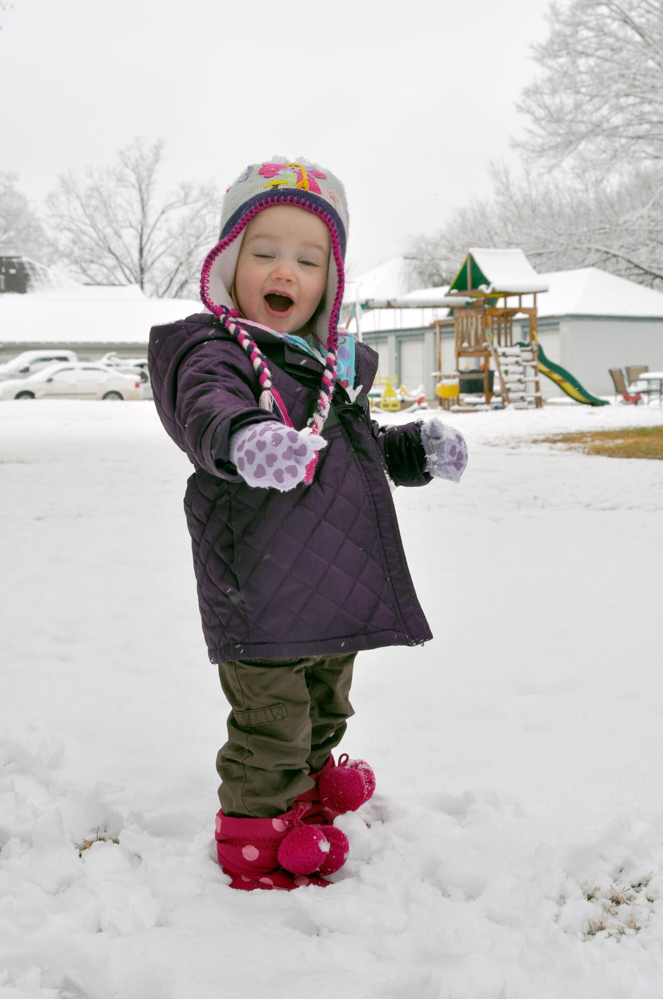 Amirah Jordan, daughter of a public affairs representative for the 917th Wing on Barksdale Air Force Base, La., freaks out as she touches snow for the first time. Jordan, who lives on Barksdale Air Force Base, woke to a two- and-a-half inch layer of snow in her front yard on Feb. 12, 2010. (U.S. Air Force Photo/Senior Airman Crystal Marie Jordan)