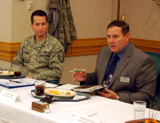 Senior Master Sgt. Tom Johnson, Chapter 1156 Air Force Sergeant's Association president, listens in on AFSA International President Jimmy LeDoux speaking to the  council about the group's role in several legislative issues during a luncheon at the base dining facility Feb. 9. (U.S. Air Force photo/Airman 1st Class Kristina Overton)