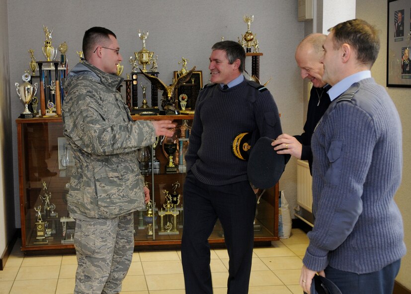 RAF MILDENHALL, England – Air Commodore Les O’Dea, Headquarters, Air Commanding Directly Administered Units, greets Capt. Robert Clouse, 100th Security Forces Squadron, on his way to visit Ministry of Defence employees working there Feb. 22.  (U.S. Air Force photo/Staff Sgt. Christopher L. Ingersoll)