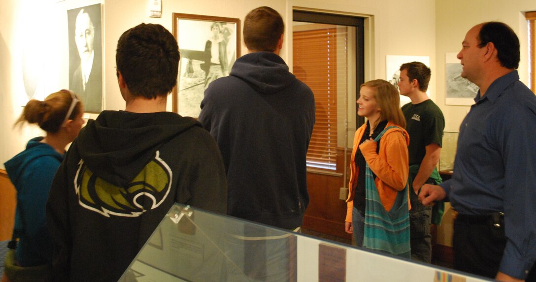 George Strader, Sheppard Air Force Base curator, teaches members of Americorps Volunteers about Sheppard AFB history during a base tour Feb. 19.  Americorps Volunteers is an organization that allows volunteers of all ages to address critical needs in their community.  (U.S. Air Force photo/Tech Sgt. Vernon J. Cunningham)