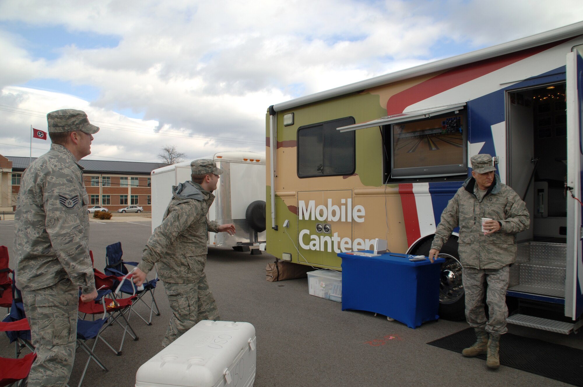 Staff Sgt. Jason Thompson and Staff Sgt. Mark Schermerhorn, of 118th Maintenance, take a break to go Wii bowling, Feb. 17.