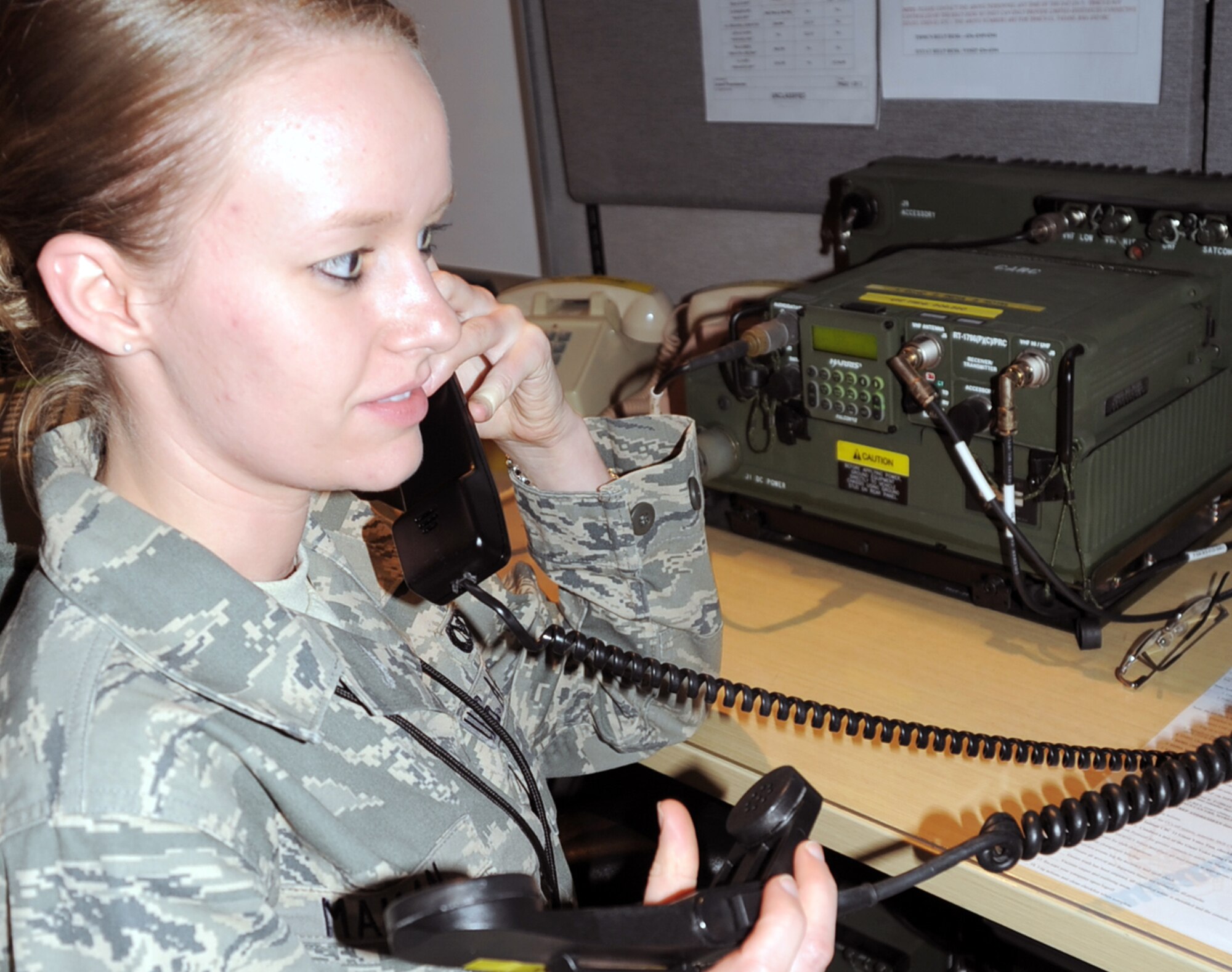 Senior Airman Casey Mahan, command post journeyman for the 380th Air Expeditionary Wing Command Post, works in her office at a non-disclosed base in Southwest Asia on Feb. 3, 2010. Airman Mahan is deployed from the 90th Missile Wing Command Post at F.E. Warren Air Force Base, Wyo., and her hometown is Perryville, Ark. (U.S. Air Force Photo/Master Sgt. Scott T. Sturkol/Released)