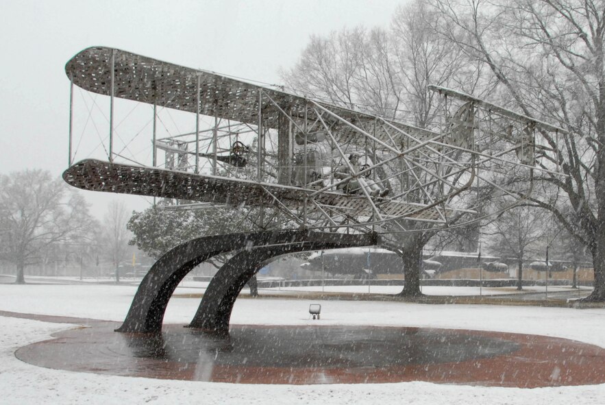 The Wright-Flyer sculpture at Maxwell is bathed in heavy snowfall Feb. 12. A total of two inches of snow accumulated during Friday's storm that lasted from sunrise to about 4 p.m.(U.S. Air Force photo by Bennett Rock)