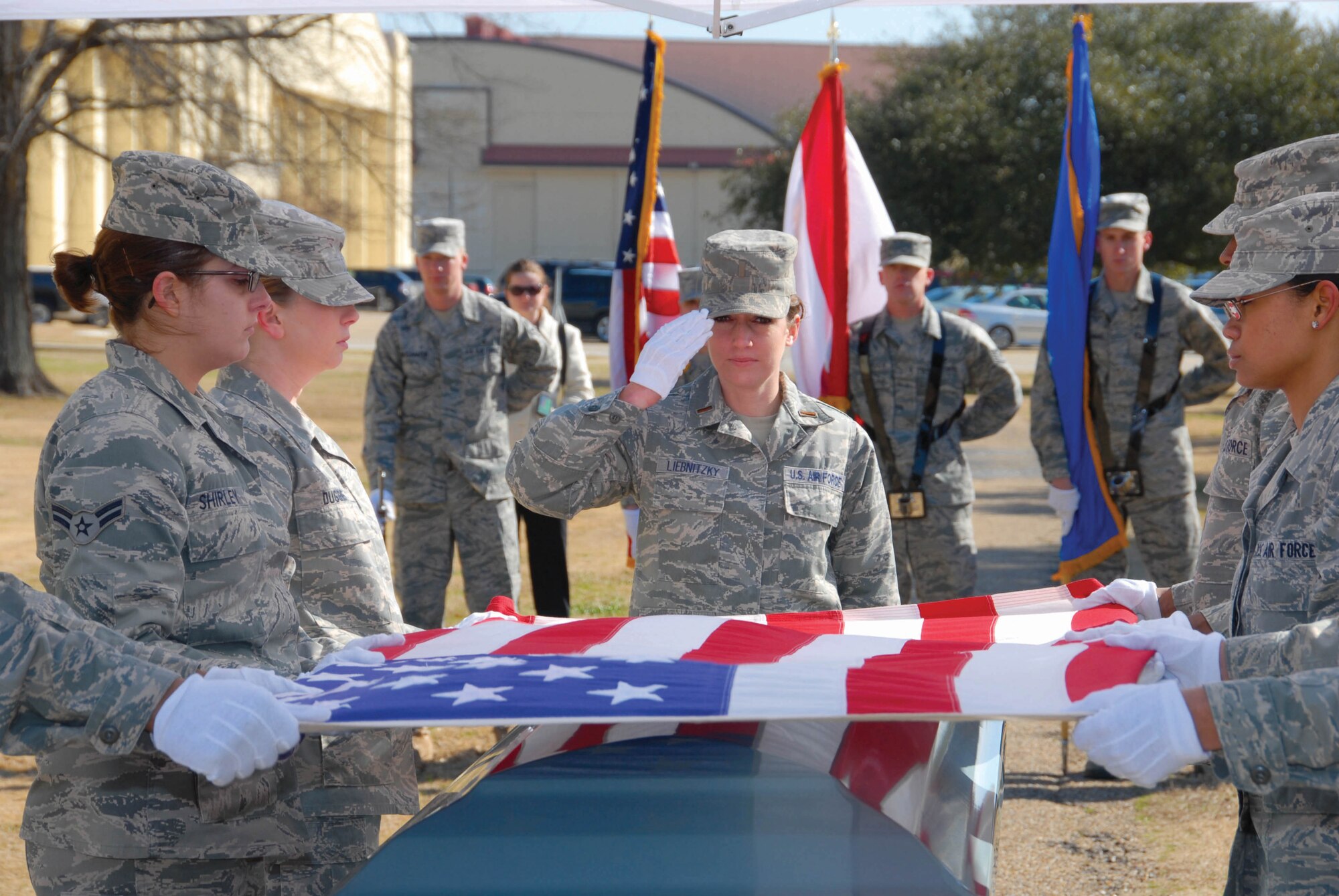2nd Lt. Sherry Liebnitzky renders a final salute as she and other members of a graduating honor guard class Feb. 10 conduct a funeral demonstration at Maxwell’s honor guard training facility. Members of the Air Force Honor Guard from Bolling AFB, D.C., helped train the Maxwell class of 25 volunteers.(U.S. Air Force photo by Bennett Rock)