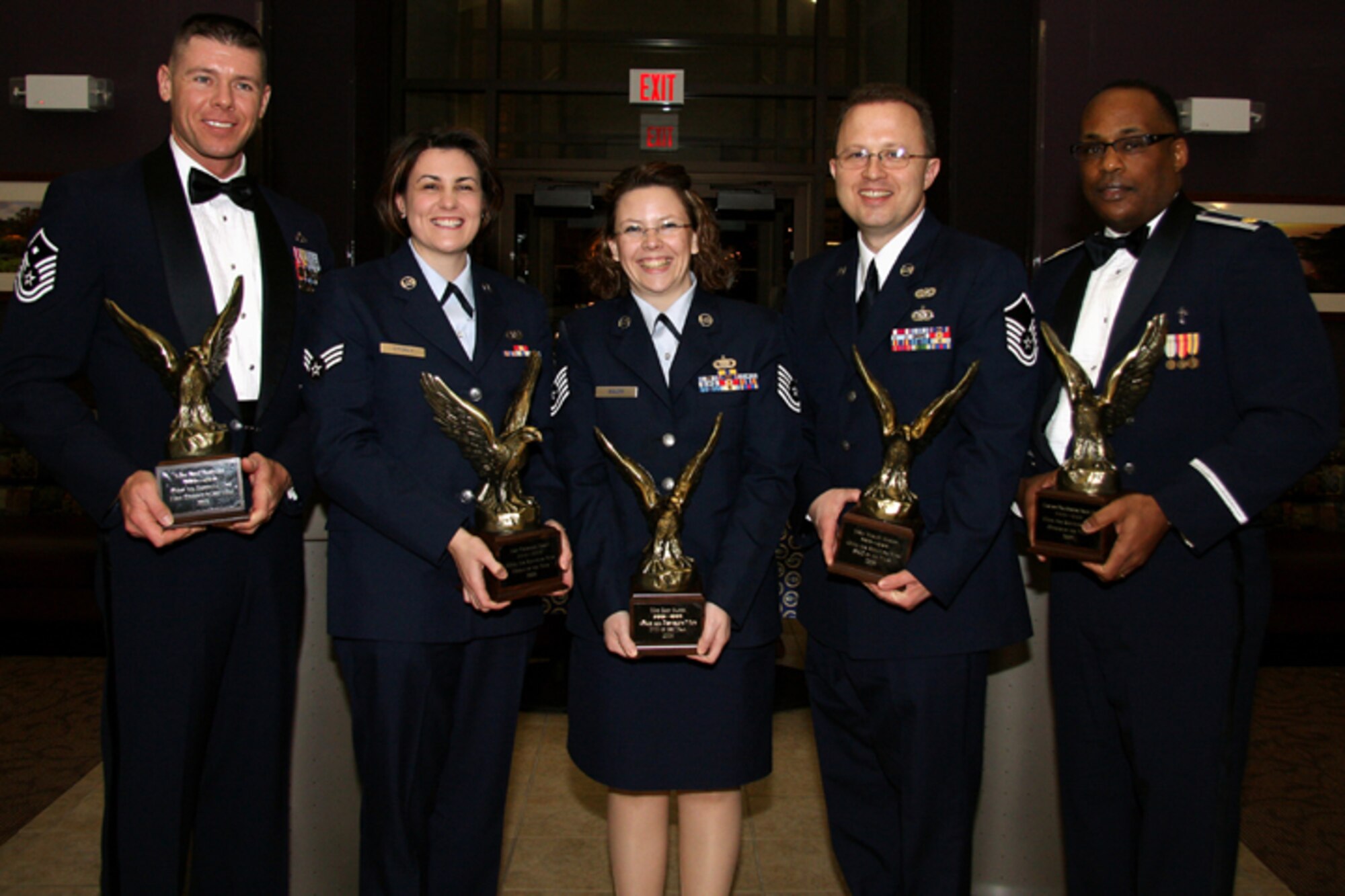 GRISSOM AIR RESERVE BASE, Ind. -- (From left to right) Master Sergeant Paul Tomlinson, Senior Airman Courtney Storey, Tech. Sgt. Erin Baker, Master Sgt. Wes Marion and Chaplain (Maj.) Obadiah Smith stand with their trophies during the annual awards banquet held recently at the dining facility. Military personnel, Grissom Community Council members and families were in attendance. (U.S. Air Force photo/Tech. Sgt. Mark. R. W. Orders-Woempner)