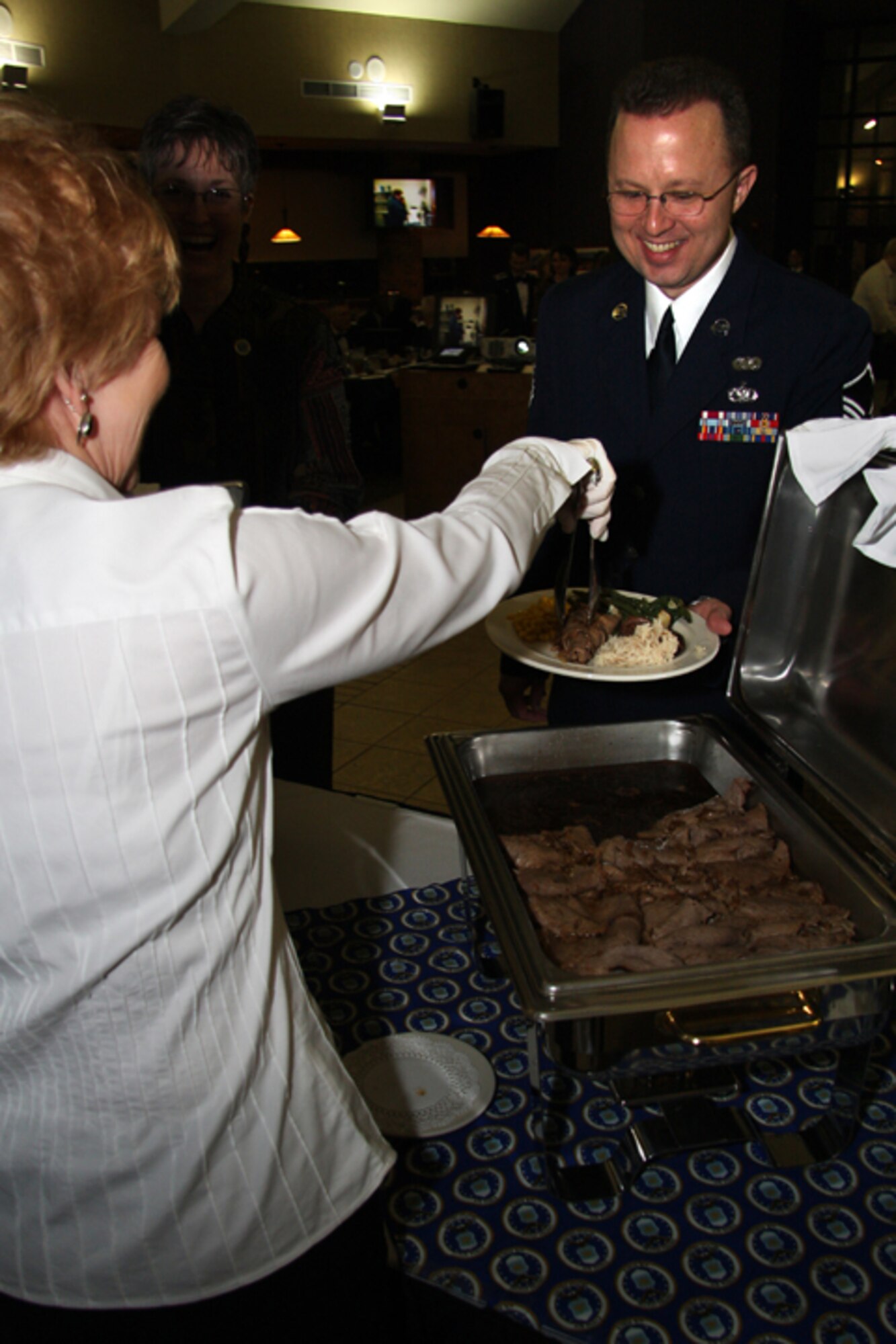 GRISSOM AIR RESERVE BASE, Ind. -- Master Sgt. Wes Marion, 434th Air Refueling Wing legal office superintendent, goes through a buffet line during an annual awards banquet held recently. The banquet honored 434th ARW annual award winners and was held at the Grissom dining facility. Sergeant Marion was named 434th ARW Senior Noncommissioned Officer of the Year. (U.S. Air Force photo/Tech. Sgt. Mark. R. W. Orders-Woempner)