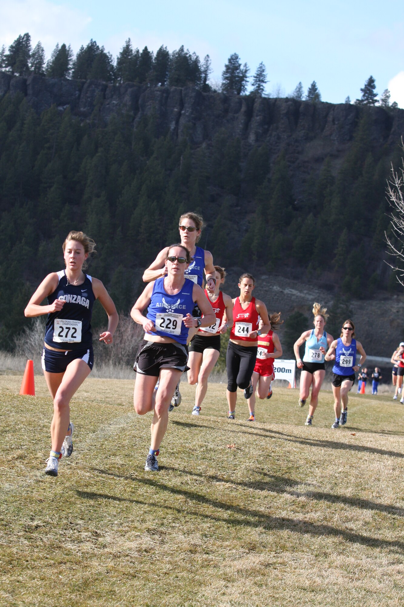 Capt. Elissa Ballas (#229), Maj. Jaymee Marty directly behind Captain Ballas, and Maj. Brenda Schrank in the background.  Captain Ballas, from the 4th Medical Operations Squadron, Seymour Johnson Air Force Base, N.C., finished in seventh place with a time of 30:44, a pace of 6:11 minutes per mile.  Major Marty, from the 60th Civil Engineering Squadron, Travis AFB, Calif., finished in 12th place with a time of 31:59, a pace of 6:26 minutes per mile. (U.S. Air Force photo by Stephen Brown)