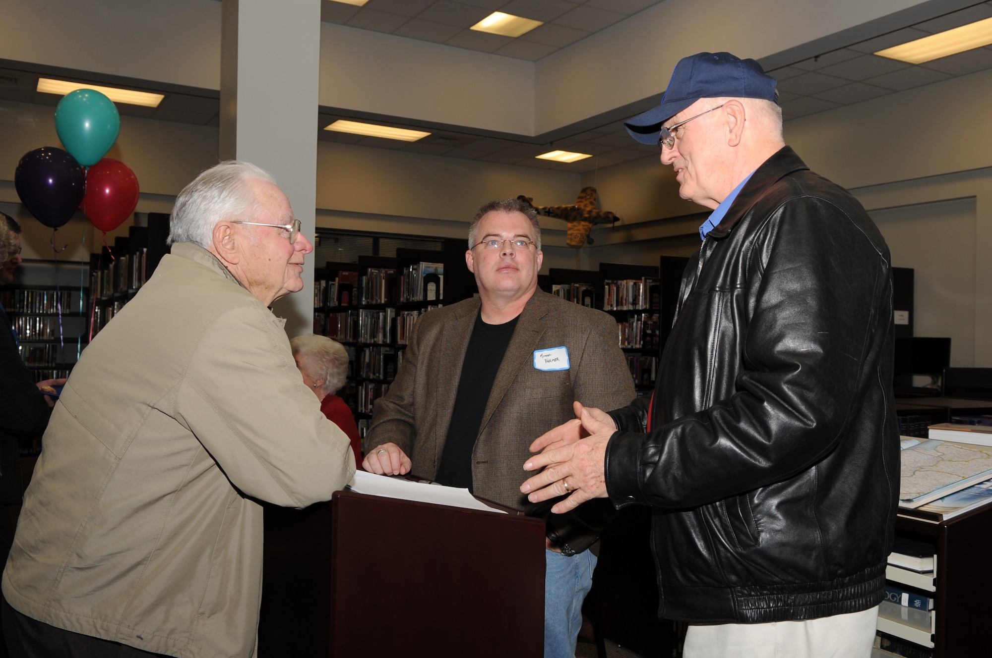 Michael Farmer, author of "WAR DOGS," discusses his military experience during a Meet the Author book signing on Seymour Johnson Air Force Base, Feb. 18, 2010. During the book signing the four authors sold copies of their books and signed autographs. Farmer, a retired Army major, resides in Pinehurst, N.C. (U.S. Air Force photo/Staff Sgt. Courtney Richardson)