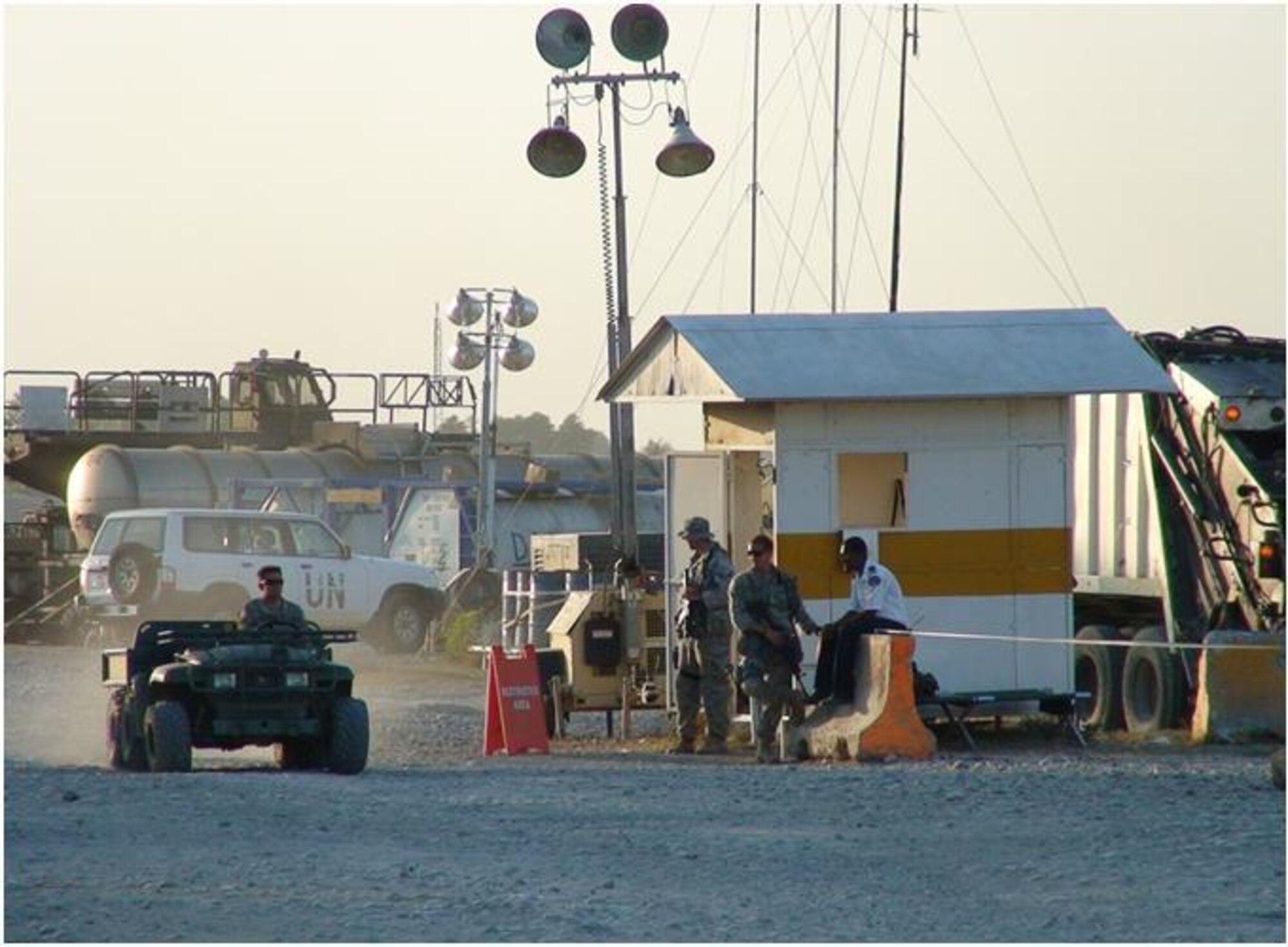 PORT-AU-PRINCE, Haiti -- Airmen from the 823rd Expeditionary Security Forces Squadron guard the main entrance to the Toussaint L'Ouverture International Airport here. (Courtesy photo)