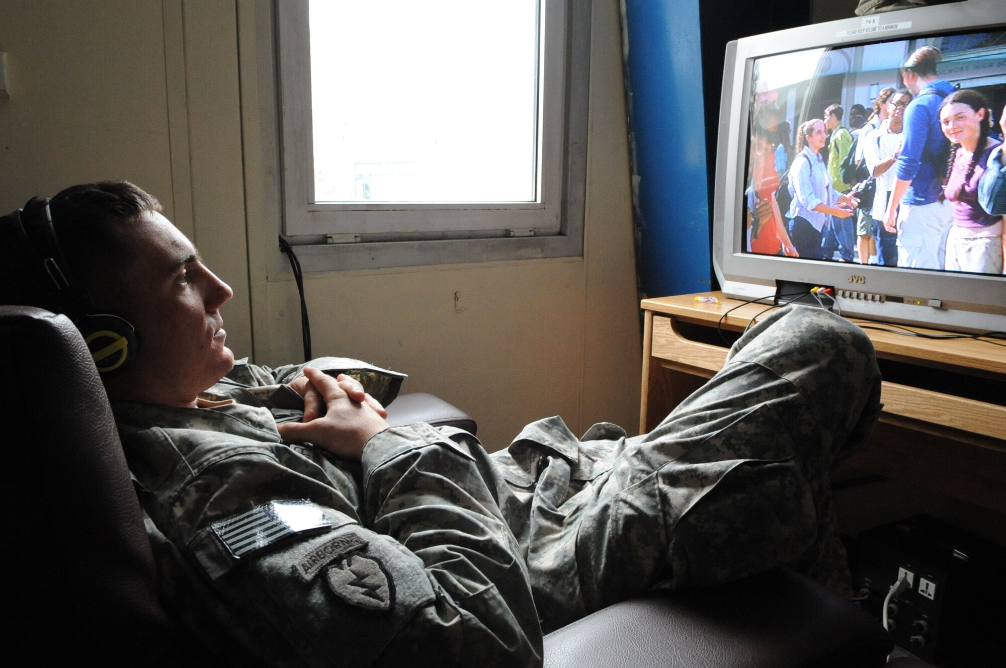 U.S. Army 1st Lt. Daniel Larson, an airborne executive officer, watches a movie at "Shooters," a recreational facility at the Transit Center at Manas, Kyrgyzstan, Feb. 19, 2010. Shooters provides morale opportunities for permanently-assigned members and transient Airmen, Soldiers, Sailors and Marines on their way to or from Afghanistan. (U.S. Air Force photo/Senior Airman Nichelle Anderson/released). 