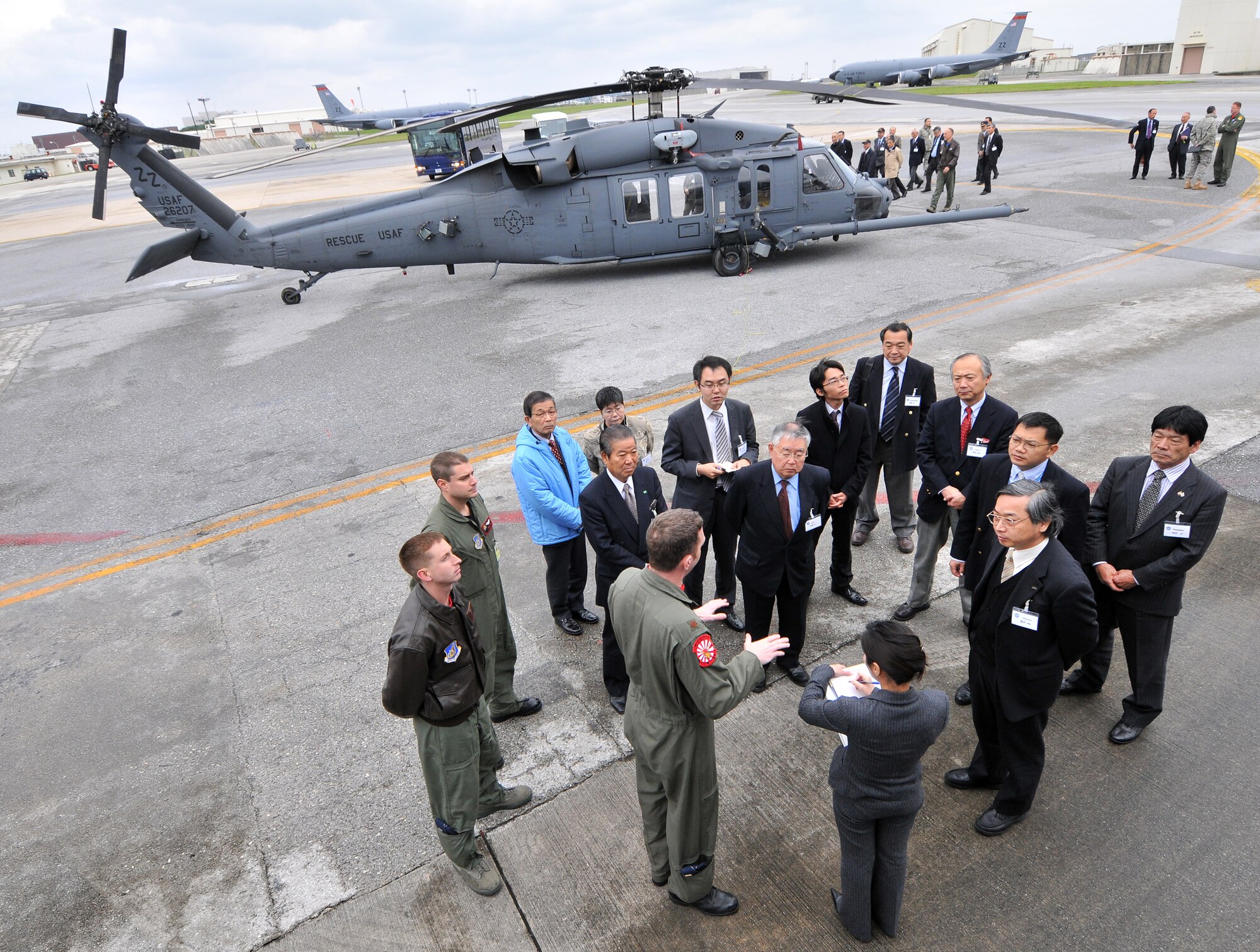 Maj. Steven Marshall, 909th Air Refueling Squadron pilot, briefs Japanese civic leaders about the 909th ARS mission at Kadena Air Base, Feb. 19. The group received a mission brief from Brig. Gen. Ken Wilsbach, 18th Wing commander, and were given the opportunity to speak to aircrew about their respective aircraft.  (U.S. Air Force photo/Tech. Sgt. Rey Ramon)   