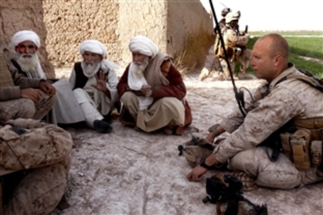 U.S. Marine Corps Capt. Stephan P. Karabin makes first contact with three village elders from the Five Points area during a patrol, Afghanistan, Feb. 14, 2010. Karabin is the commanding officer, Charlie Company, 1st Battalion, 3rd Marine Regiment. The Marines had been previously unable to meet with local leaders due to engagements with Taliban fighters during their patrols.