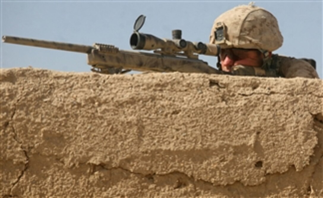 U.S. Marine Corps Sgt. Rick Keller, a scout sniper with 3rd Platoon, India Company, 3rd Battalion, 6th Marine Regiment, provides security inside a compound in Marja, Helmand province, Afghanistan, on Feb. 16, 2010.  The Marines took shelter inside the compound after clearing it of insurgents and improvised explosive devices.  Marines and Afghan National Army soldiers are conducting Operation Moshtarak to remove the Taliban from the town.  