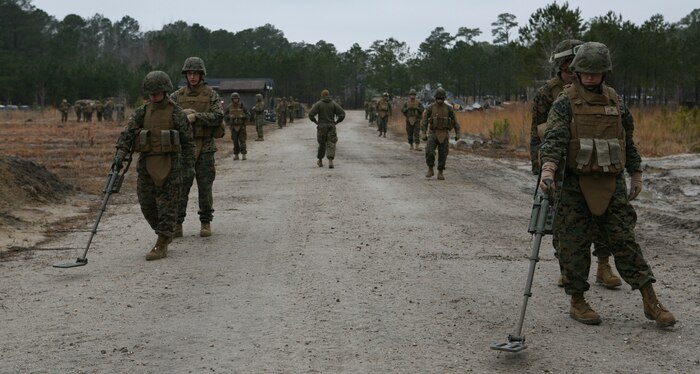 Marines with Military Police Company, Combat Logistics Regiment 27, 2nd Marine Logistics Group, conduct metal detector training during a metal detecting course aboard Camp Lejeune, N.C., Feb. 23, 2010.  The Marines attended the course to learn the proper techniques for employing a metal detector in preparation for future deployments to Afghanistan. (U.S. Marine Corps photo by Cpl. M. Bravo)