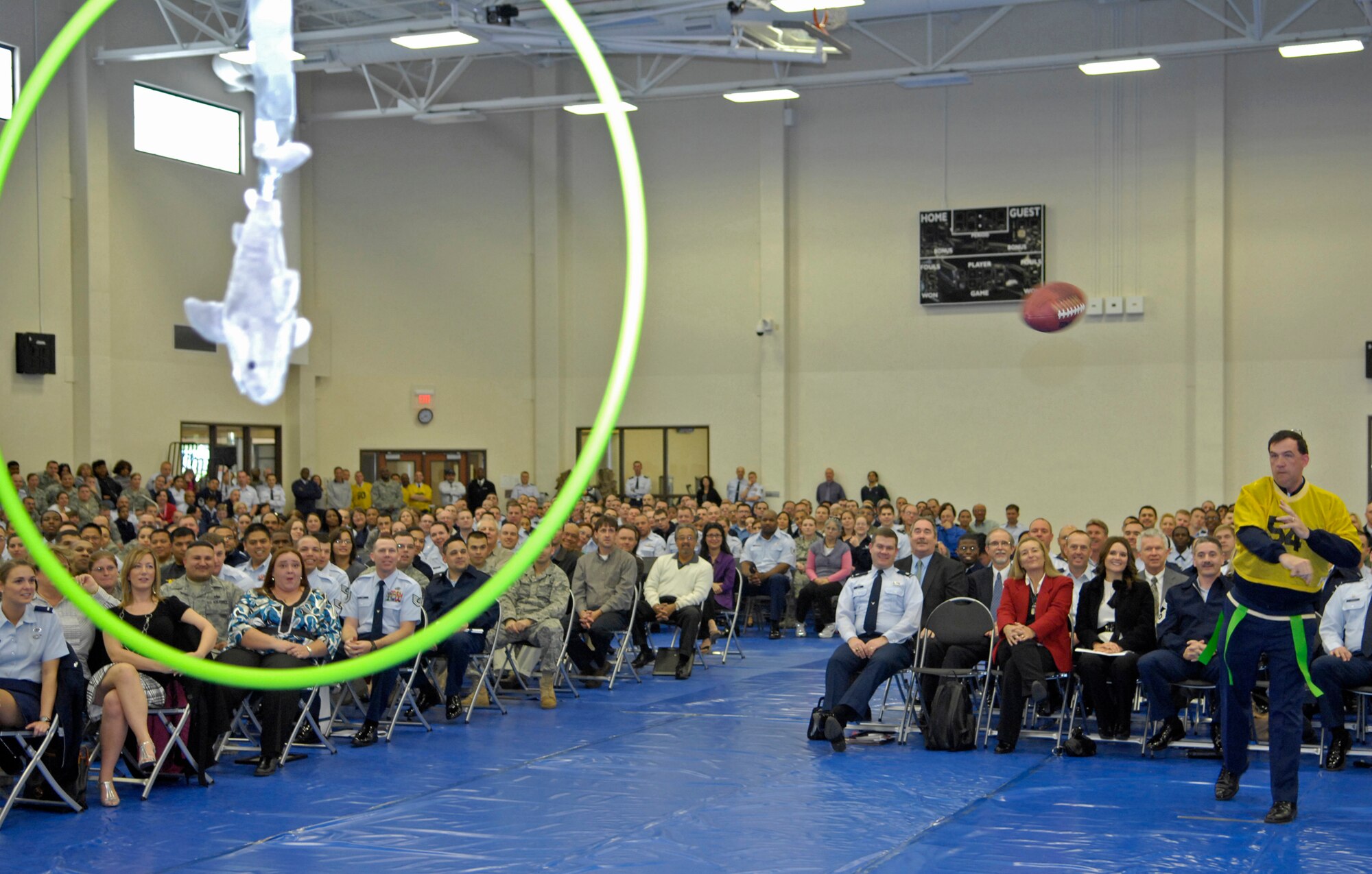 VANDENBERG AIR FORCE BASE, Calif. --  With power and accuracy, Col. Wright, the 30th Mission Support Group commander, attempts to hit the shark target in the hula-hoop with a football during the 30th Space Wing commander's call here Monday, Feb. 22, 2010. The 30th SW Hawks are up against the 45th Space Wing Sharks in the 2009 Guardian Challenge competition.  (U.S. Air Force photo/Airman 1st Class Andrew Lee)