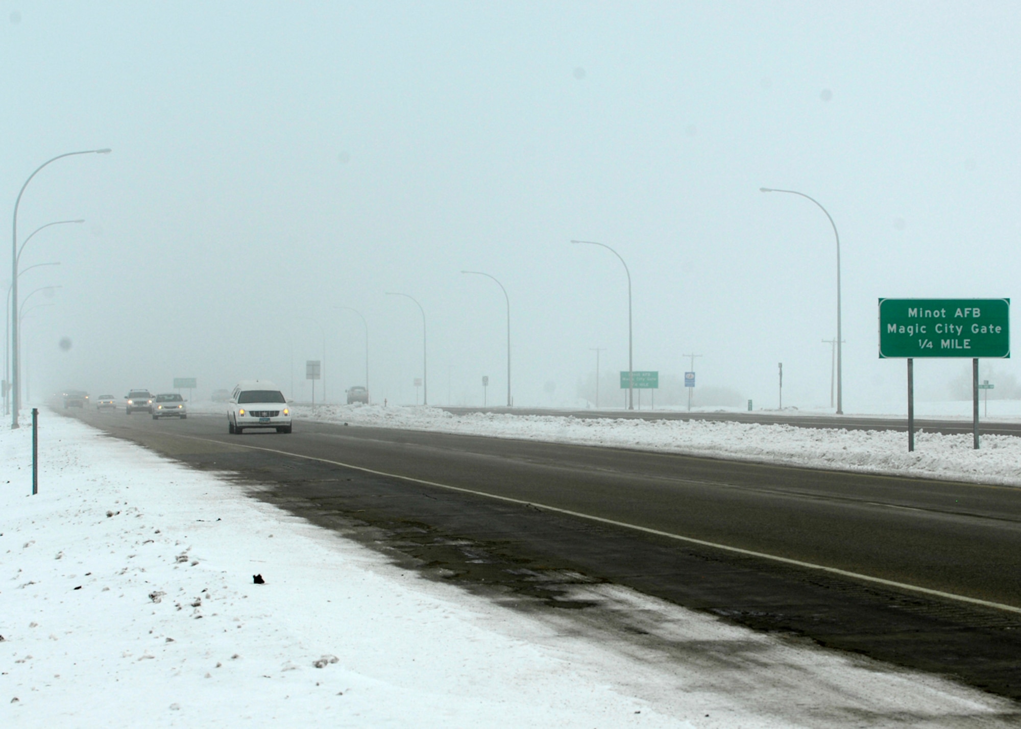 MINOT AIR FORCE BASE, N.D. -- Drivers travel through the fog on highway 83 Feb. 22. Thick fog is one of the many winter hazards all drivers should be aware and take caution. (U.S. Air Force photo by Airman 1st Class Ashley N. Avecilla)