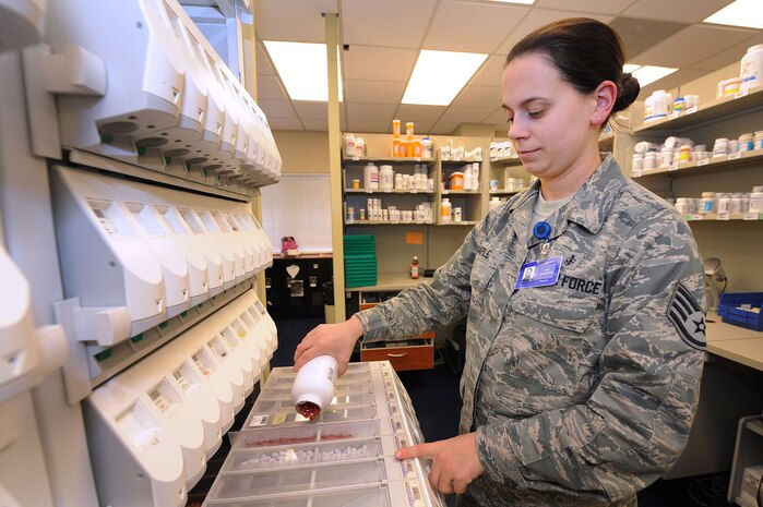 Staff Sgt. Josie Maple replenishes the pharmacists system with pills here Feb. 11.    In addition to provide pharmacy support, the 628th Medical Group provides many functional areas within such as medical logistics, laboratory, diagnostics and therapeutics, readiness training, resource management, TRICARE operations and patient administration. Sergeant Maple with the 628th MDG and is the NCO in charge of pharmacy services. (U.S. Air Force photo/James Bowman)