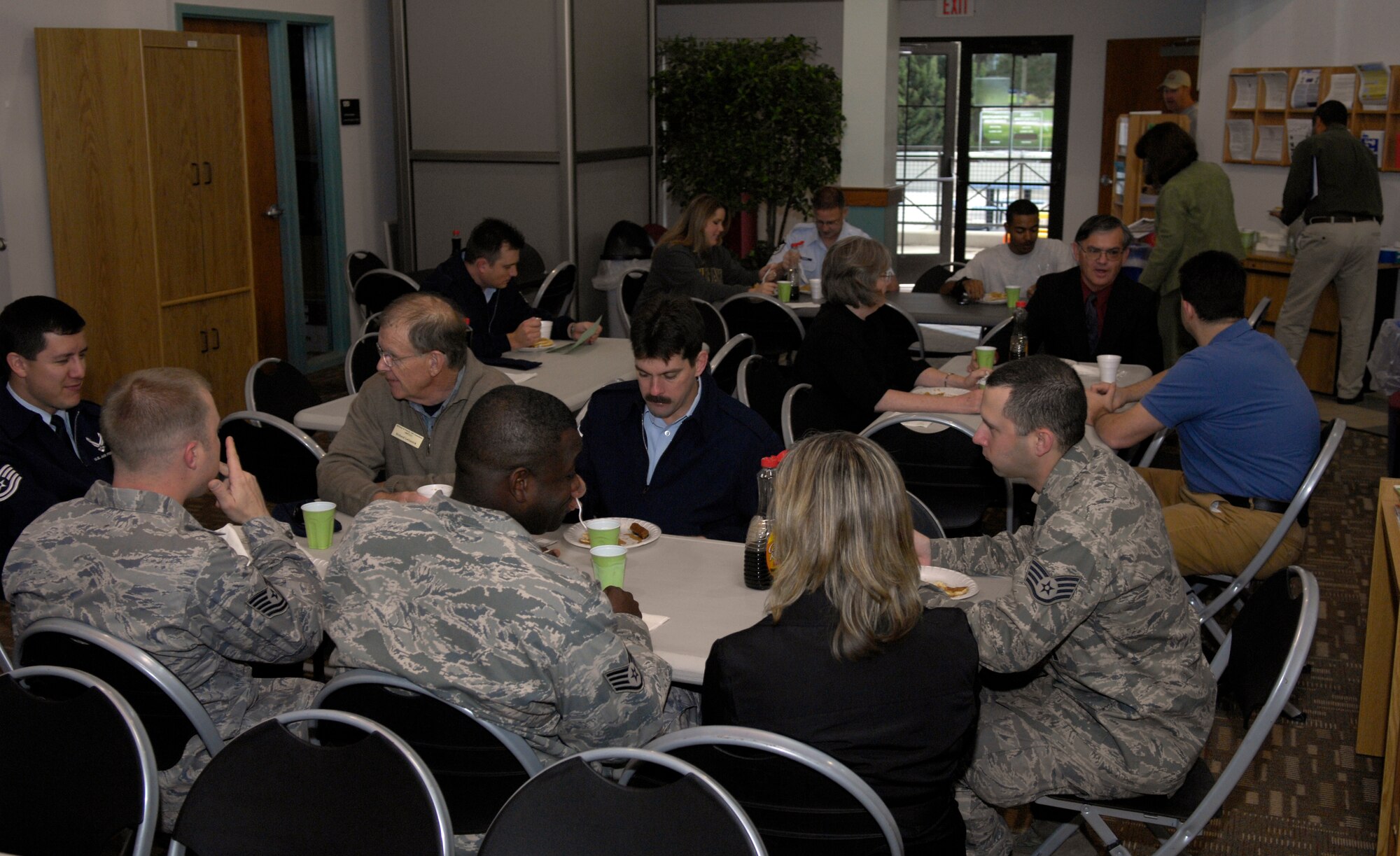 VANDENBERG AIR FORCE BASE, Calif. -- Team V eats and visits during the First Sergeants' Pancake Breakfast hosted by the Airman and Family Readiness Center here Monday, Feb. 22, 2010. The breakfast was served to promote Military Saves Week as well as the classes the A&FRC is holding to inform Airmen on saving and investing. (U.S. Air Force photo/Airman 1st Class Lael Huss)