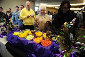 Attendees line up for free samples during the Second Annual Force Support Squadron Food Show at the Charleston Club here Feb. 18. Individuals at the show tasted and voted on their favorite foods to be considered for addition to menus at various restaurants around base. (U.S. Air Force photo/Staff Sgt. Ali Flisek)
