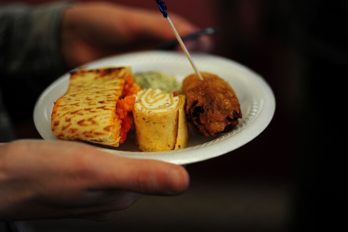 A wide variety of food vendors handed out free samples during an annual food show at the Charleston Club here Feb. 18. Individuals at the show tasted and voted on their favorite foods to be considered for addition to menus at various restaurants around base. (U.S. Air Force photo/Staff Sgt. Ali Flisek)