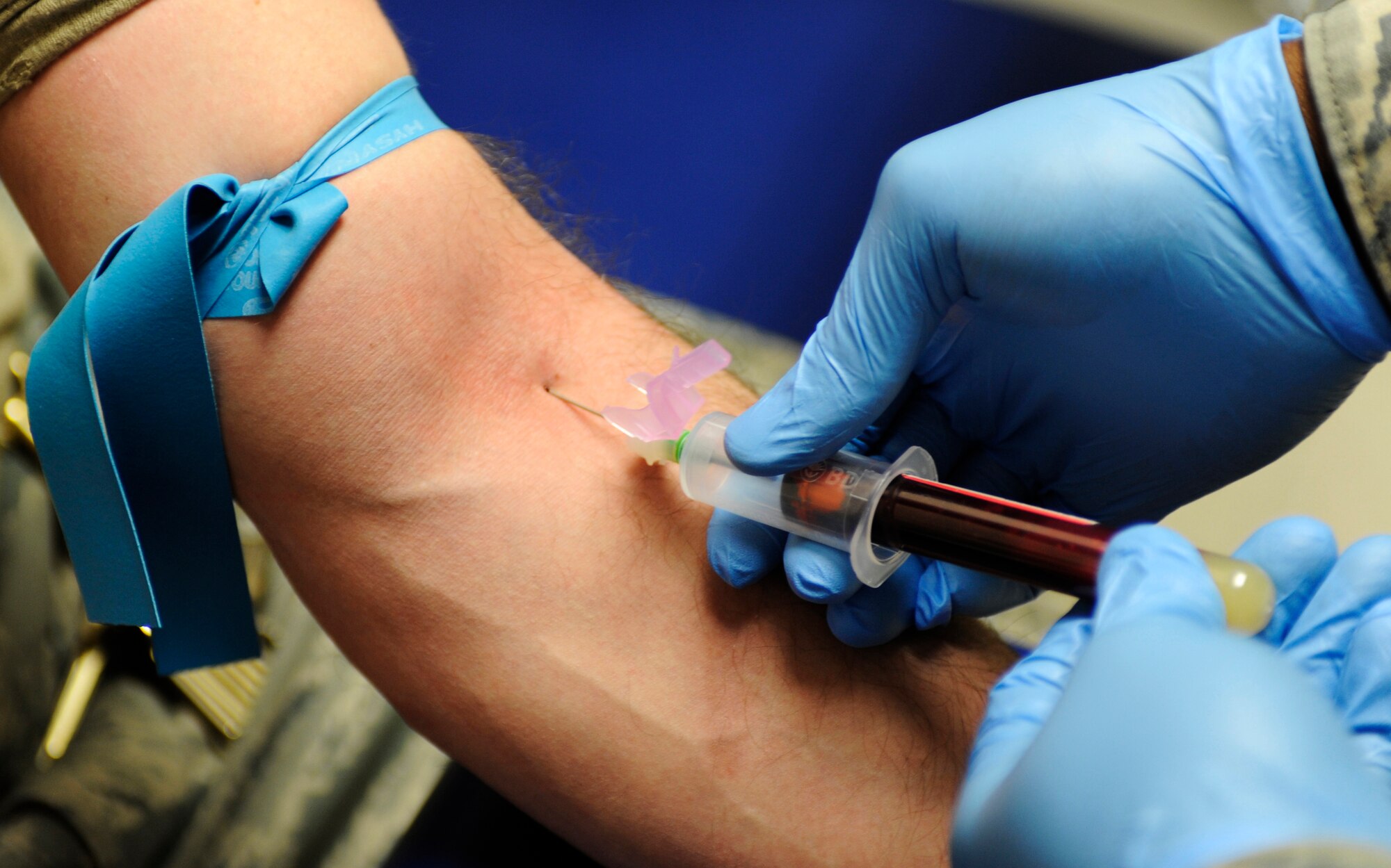 An Airman gets blood drawn for a pre-deployment screening Feb. 17, 2010, at Eielson Air Force Base, Alaska. This test can screen different things depending on what public health deems necessary. Blood is also drawn post deployment. (U.S. Air Force photo by Airman 1st Class Willard E. Grande II)