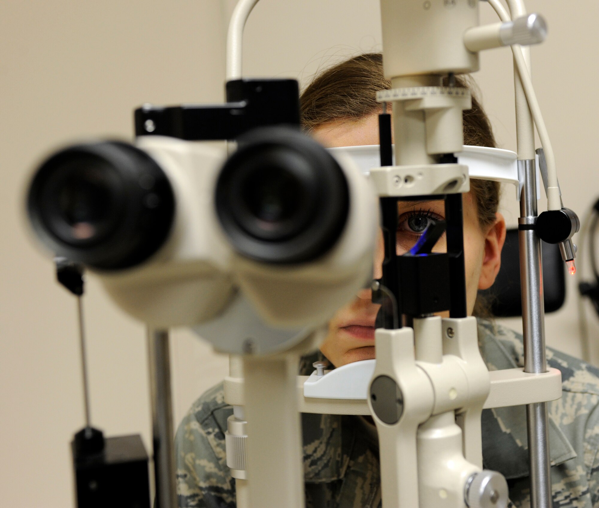 Airman Alyssa Carlson looks into a slit lamp Feb. 17, 2010, at Eielson Air Force Base, Alaska. The slit lamp inspects the front of the eye for disorders. Airman Carlson is a 354th Medical Group public health technician. (U.S. Air Force photo/Airman 1st Class Willard E. Grande II)