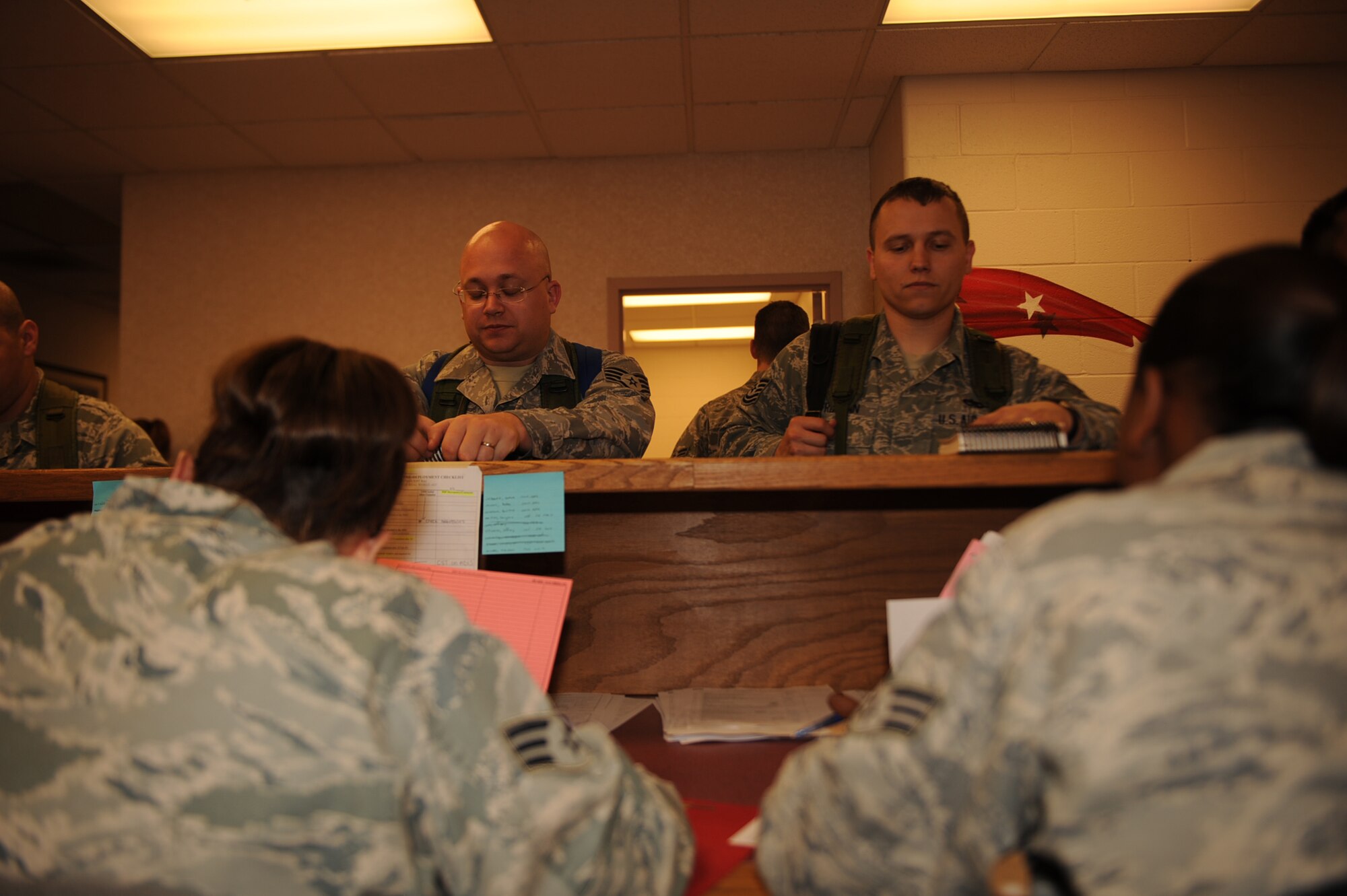Airmen from the 4th Force Support Squadron military personnel element check deployment records during a Phase I exercise on Seymour Johnson Air Force Base, N.C., Feb. 23, 2010. A review of deployment records is done to ensure personnel information is current and accurate. (U.S. Air Force photo/Senior Airman Ciara Wymbs) 