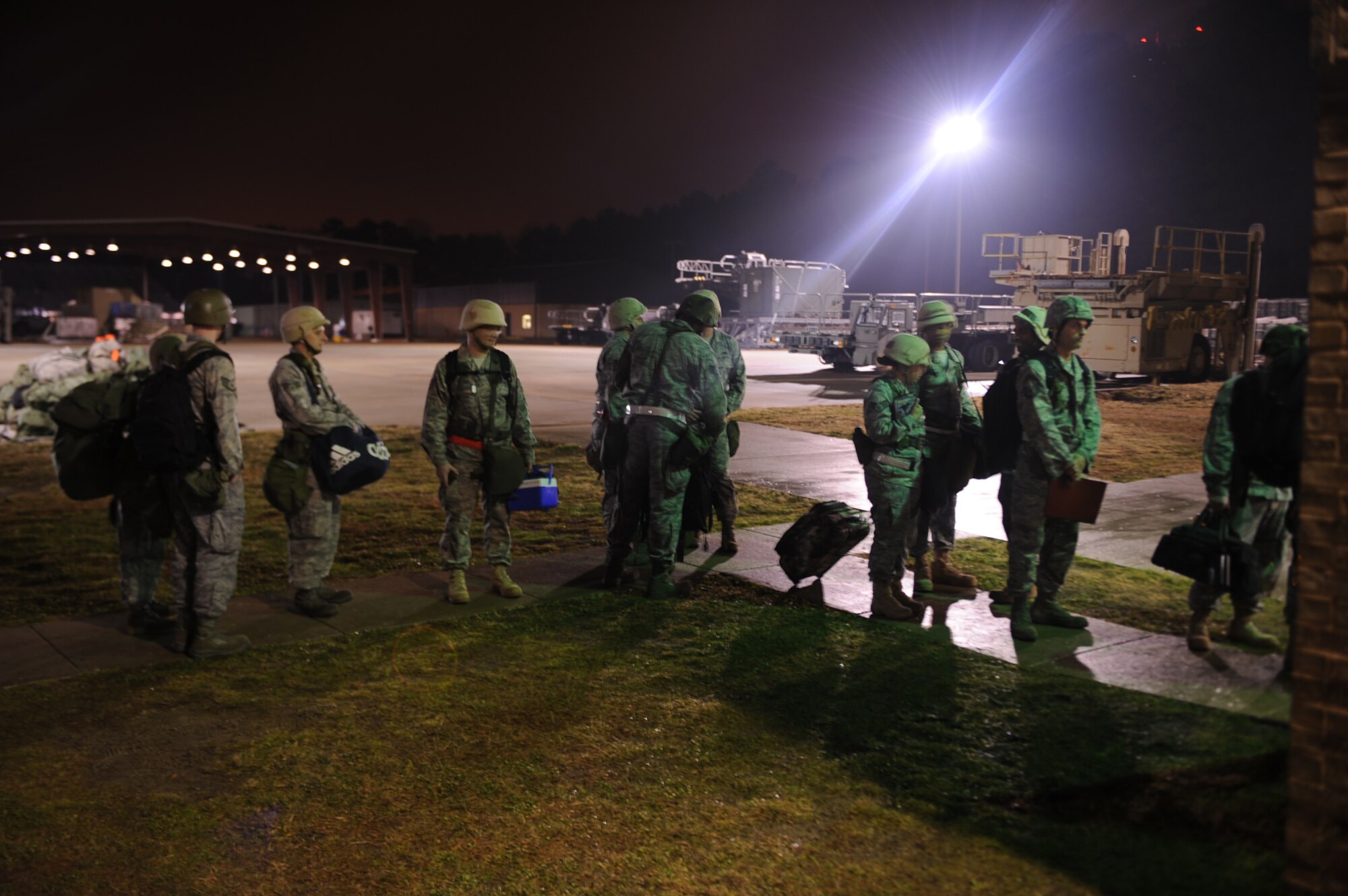 Airmen wait in a processing line at the personnel deployment function building during a Phase I exercise on Seymour Johnson Air Force Base, N.C., Feb. 23, 2010. During the Phase I, Airmen and units prepare items for deployment such as mobility bags, hazardous materials, classified items, weapons and ammunition based on deployment taskings which are not always part of a standard air expeditionary force deployment. (U.S. Air Force photo/Senior Airman Ciara Wymbs) 