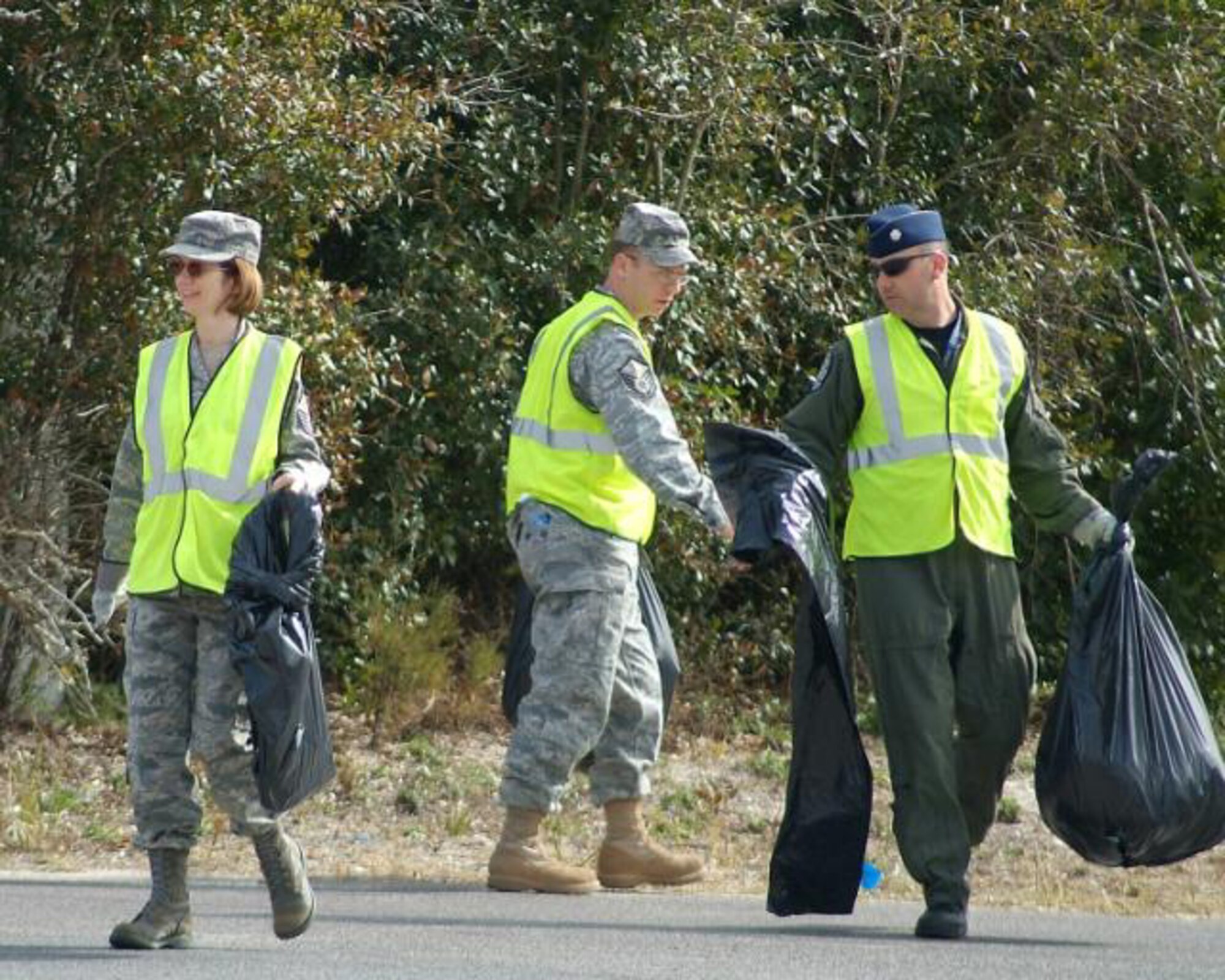FORT WALTON BEACH, Fla. – Master Sgt. Donna Hustad, Master Sgt. Mark Young and Lt. Col. Raymond Roszkowski were among 20 volunteers cleaning up James Lee Road on Feb. 19.  Volunteers from from the 505th Command and Control Wing come out every few months to pick up trash along the road, part of the wing’s participation in the Adopt-a-County-Road program. (Photo by Keith Keel/U.S. Air Force)