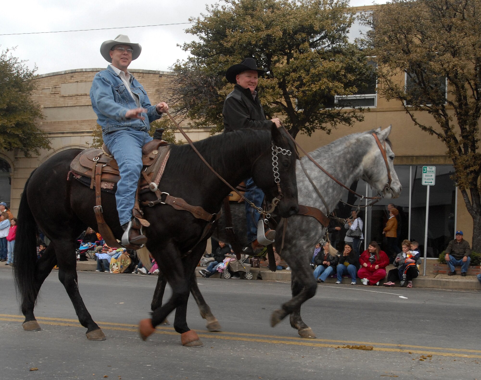 Col.  David Rearick, 17th Training Wing vice commander, waves to the crowd during the annual San Angelo Rodeo and Stock Show parade Feb. 20, 2010.  The city of San Angelo, Texas hosts a rodeo each year and the 17th Training Wing shows its support for the local community through participating in the parade and providing volunteers to assist throughout the rodeo. (U.S. Air Force photo/Master Sgt. Randy Mallard)