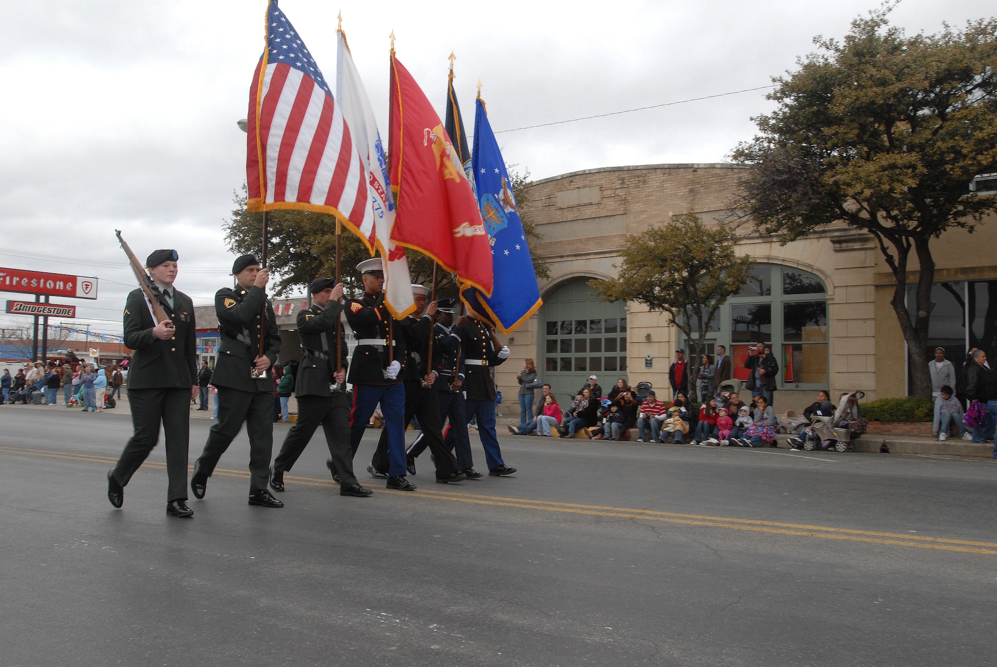 The Goodfellow AFB Joint Service Color Guard leads of the annual San Angelo Rodeo and Stock Show parade Feb. 20, 2010.  The city of San Angelo, Texas hosts a rodeo each year and the 17th Training Wing shows its support for the local community through participating in the parade and providing volunteers to assist throughout the rodeo. (U.S. Air Force photo/Master Sgt. Randy Mallard)