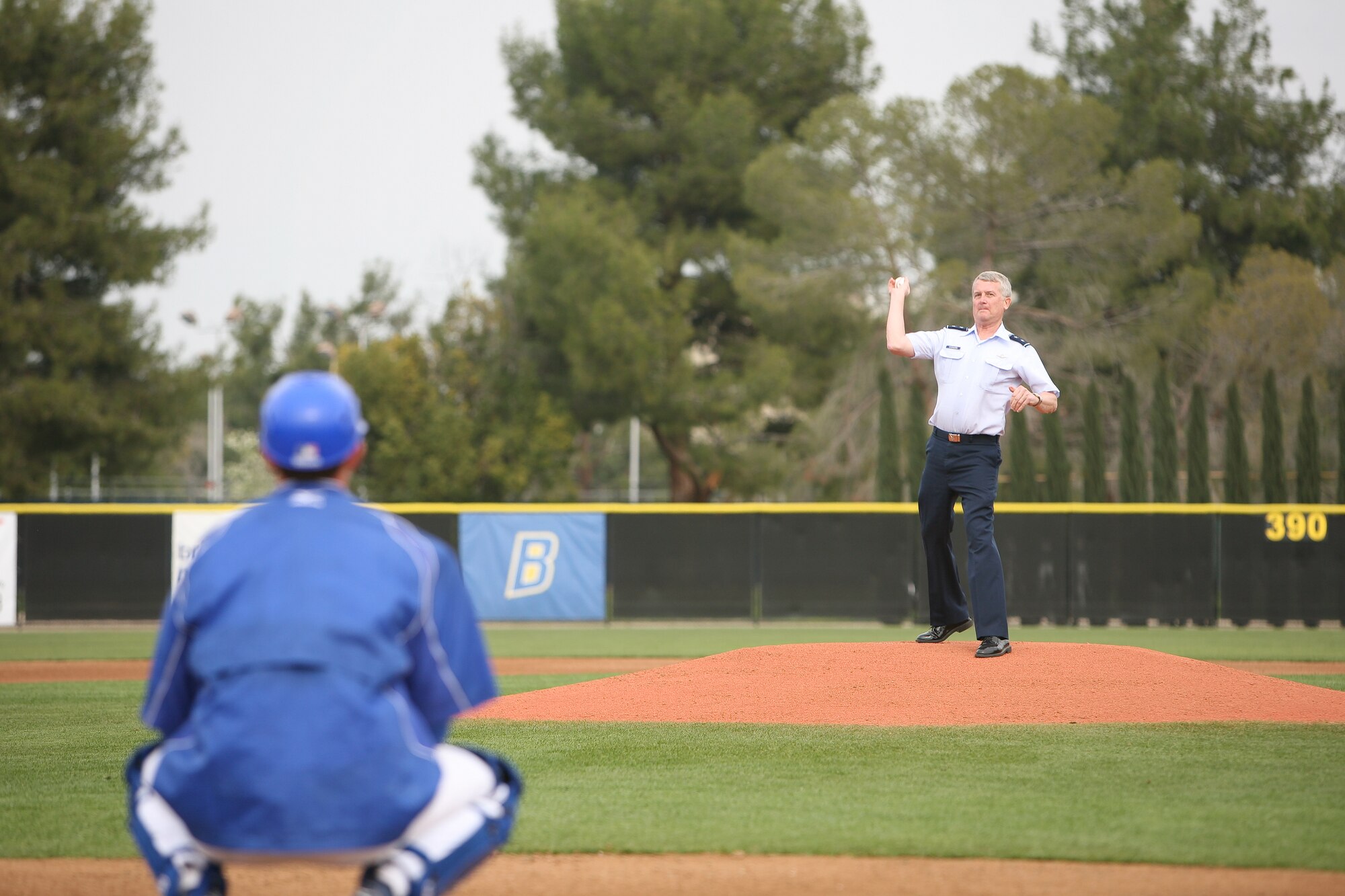 Maj. Gen. David Eichhorn, Air Force Flight Test Center commander, throws out the first pitch at the California State University at Bakersfield baseball game against the Air Force Academy Feb. 19 at Hardt Field in Bakersfield, Calif. General Eichhorn was joined by Casey Schaushlager, who also threw out a ceremonial pitch. The General was invited to the game as part of the CSU Bakersfield "Salute to the Troops." (Courtesy photo)