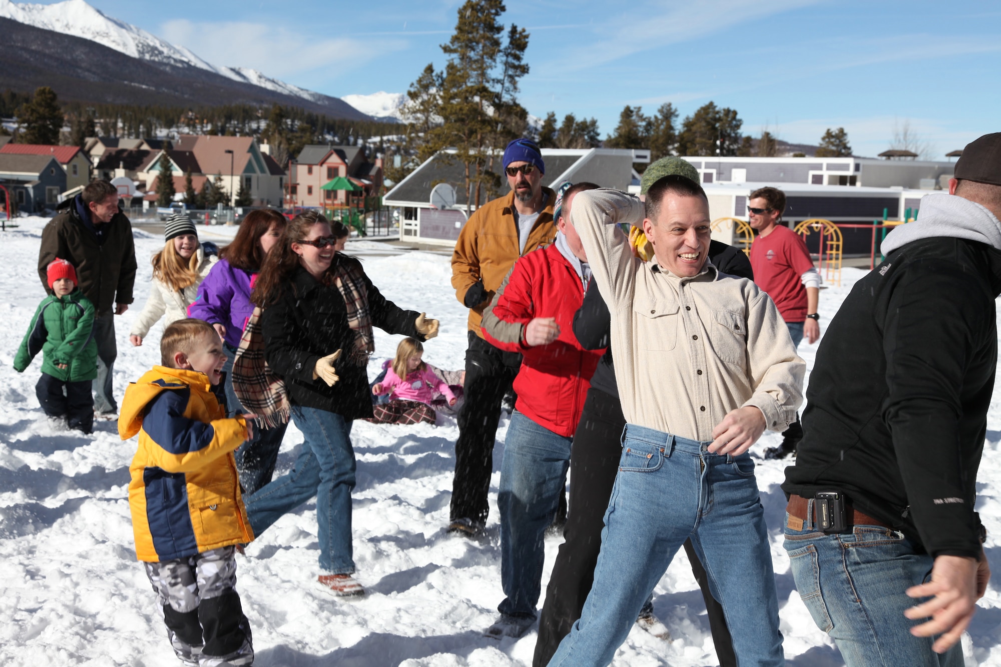Maj. Jerry Becker, COARNG, passes a rubber chicken to a player behind hime during Family Games at the Colorado National Guard Yellow Ribbon Reintegration Retreat, Breckenridge, CO.  Members and their families, as well as members of the Colorado National Guard Family Support Group attend a family retreat in Breckenridge. Children were taught to snowshoe, families participated in outdoor games and exercises. (U.S. Air Force photo/Technical Sgt. Kevin Coulter) (RELEASED)
