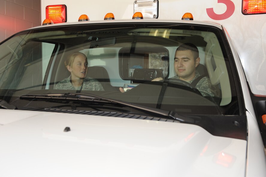 WHITEMAN AIR FORCE BASE, Mo. - Senior Airmen Melissa Lerch and Juan Vazquez, 509th Medical Operations Squadron aerospace medical technicians, respond to an emergency call, Feb. 23, 2010. Ambulance Services are on-call 24 hours a day, ready to respond to anything from an emergency landing on the airfield, to a sprained ankle at the fitness center. (U.S. Air Force photo/ Airman 1st Class Carlin Leslie)

