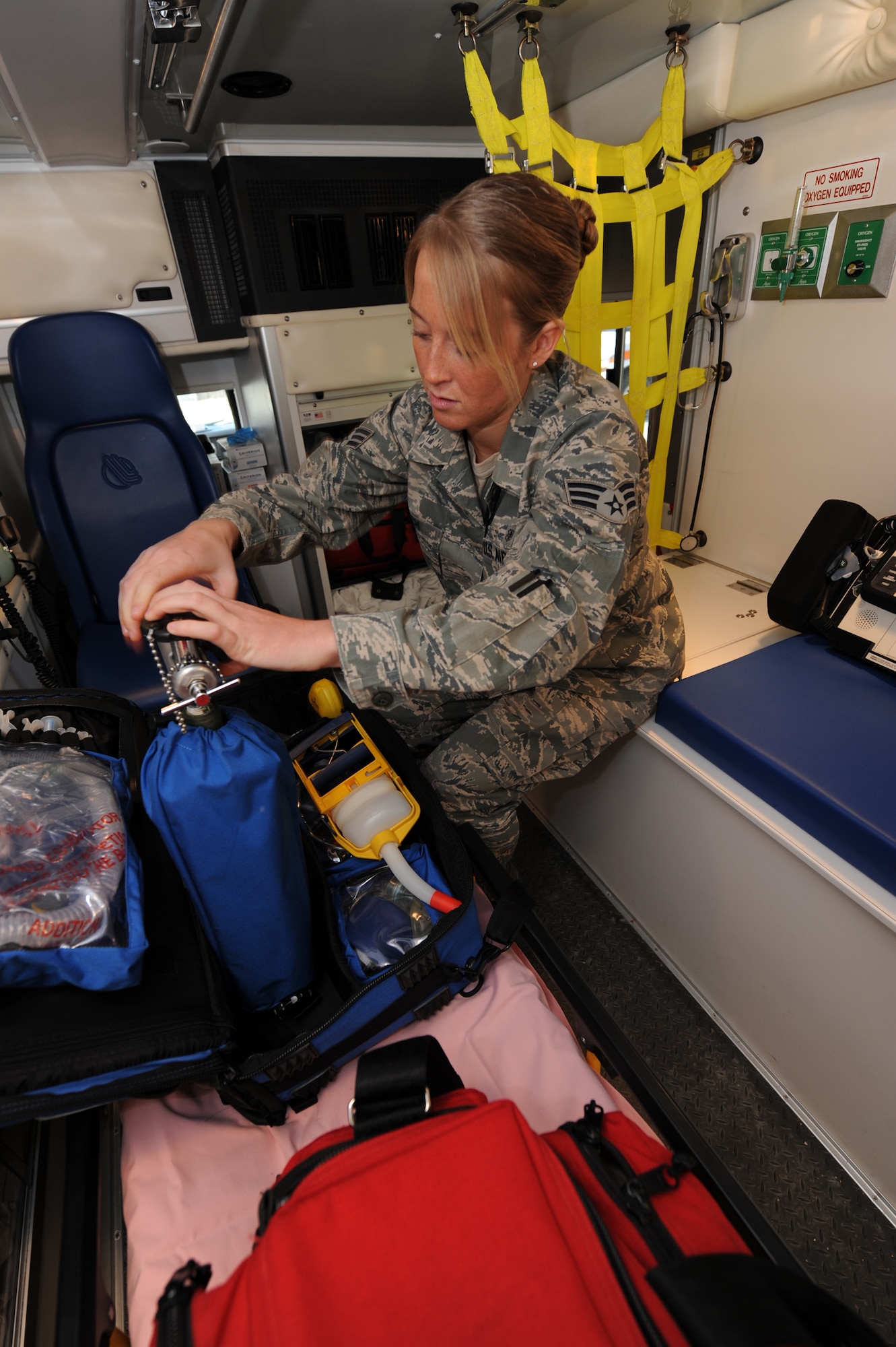 WHITEMAN AIR FORCE BASE, Mo. - Senior Airman Melissa Lerch, 509th Medical Operations Squadron, aerospace medical technician, inspects oxygen bottle levels at the beginning of her shift, Feb. 23. Ambulance Services are on-call 24 hours a day, ready to respond to anything from an emergency landing on the airfield, to a sprained ankle at the fitness center. (U.S. Air Force photo/ Airman 1st Class Carlin Leslie)


