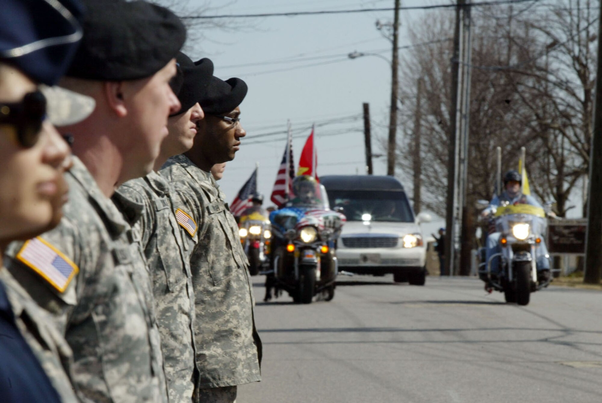 Members of the Patriot Guard render a salute to Pfc. Jason H. Estopinal, a fallen Marine returning home during a dignified here Feb. 20. Estopinal was killed Monday while supporting Operation Enduring Freedom during combat operations in the Helmand province of Afghanistan. He was assigned to the 2nd Battalion, 2nd Marine Regiment, 2nd Marine Division, II Marine Expeditionary Force, Camp Lejeune, N.C. (U.S. Air Force photo/Don Peek)