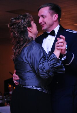 Col. Jeffrey Taliaferro, 28th Bomb Wing commander, dances with his wife Ellie during the 28 BW Winter Formal, Feb. 20. The U.S. Air Force Heartland of America Band "Night Wing" performed music during the event. (U.S. Air Force photo/Airman 1st Class Anthony Sanchelli)