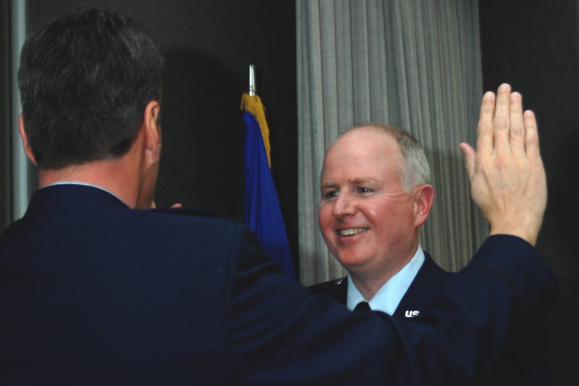GRISSOM AIR RESERVE BASE, Ind. , -- Col. Thom Pemberton,  434th Operations Group, smiles as he takes the oath recognizing his new rank of colonel. The oath was being given by Col. Randy Ogden, 434th Operations Group commander.   (U.S. Air Force photo/Tech. Sgt. Doug Hays)