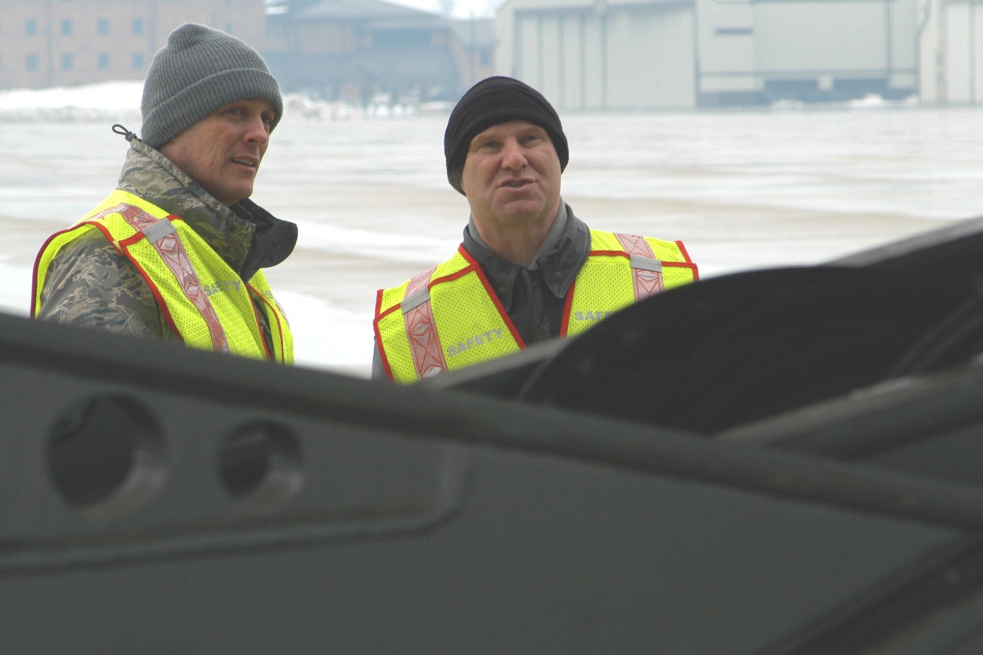 GRISSOM AIR RESERVE BASE, Ind., -- Master Sgt. Johnny Armes, left, and Lt. Col. Miles Heaslip, both from the 434th Air Refueling Wing safety office, watch as ground personnel work with flight engineers to load a C-5 Galaxy during a cargo processing  exercise held recently. (U.S. Air Force photo/Staff Sgt. Chris Bolen)