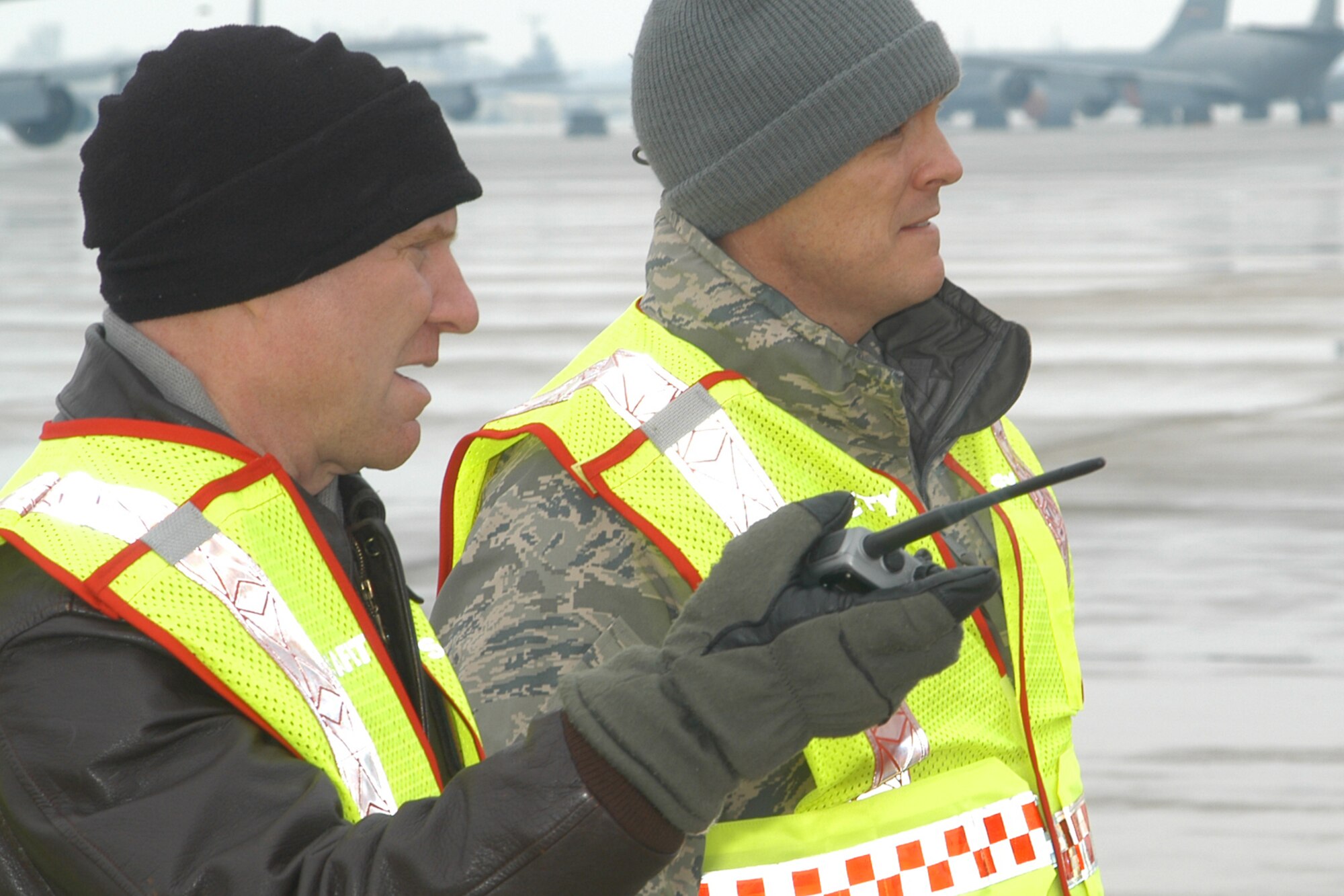 GRISSOM AIR RESERVE BASE, Ind., -- Lt. Col. Miles Heaslip, left, and Master Sgt. Johnny Armes, both from the 434th Air Refueling Wing safety office, discuss observances as they monitor ground personnel working to load a C-5 Galaxy during a recent cargo processing  exercise. (U.S. Air Force photo/Staff Sgt. Chris Bolen)