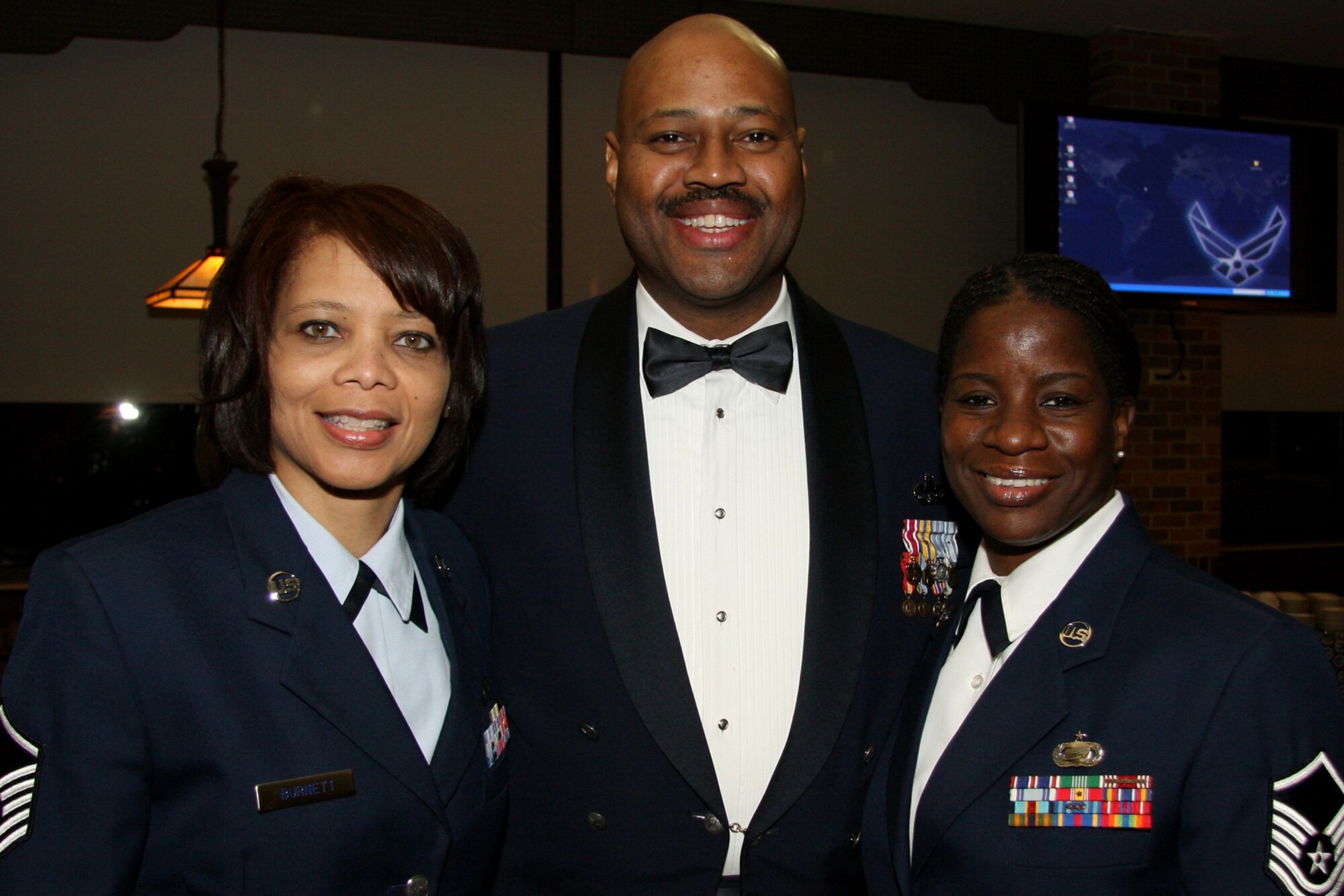 GRISSOM AIR RESERVE BASE, Ind. , -- Attendees gather for a photo at the annual awards banquet. From the left is Master Sgt. Trudy Burnett, Senior Master Sgt.  James Carter and Master Sgt. Nora Jones.  (U.S. Air Force photo/Tech. Sgt. Mark Orders-Woempner)