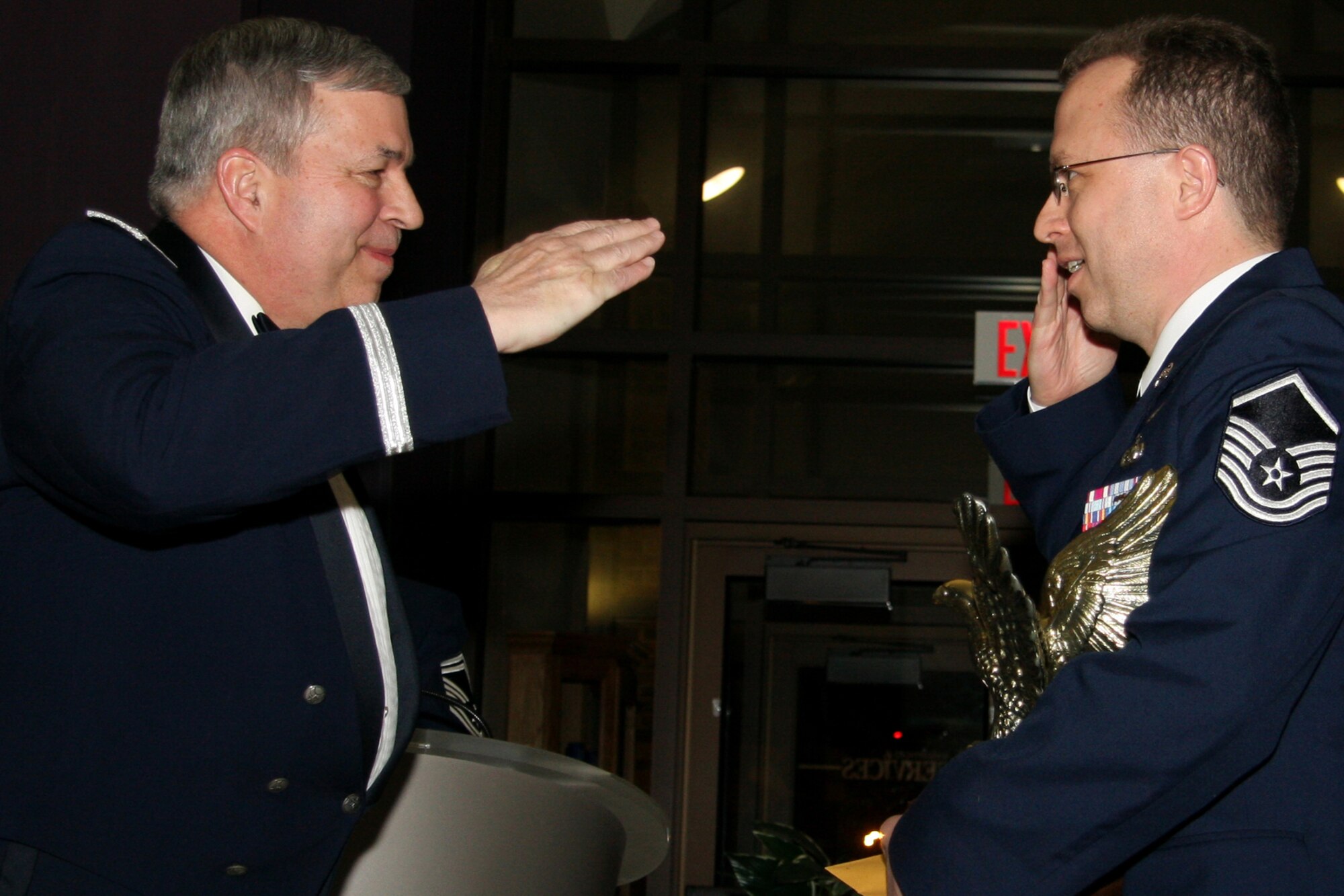 GRISSOM AIR RESERVE BASE, Ind. , -- Brig. Gen. Dean Despinoy, 434th Air Refueling Wing commander, left, returns the salute from Master Sgt. Wes Marion 434th ARW  legal office superintendent, after presenting Sergeant Marion a trophy for being the Senior NCO of the  Year. (U.S. Air Force photo/Tech. Sgt. Mark Orders-Woempner)