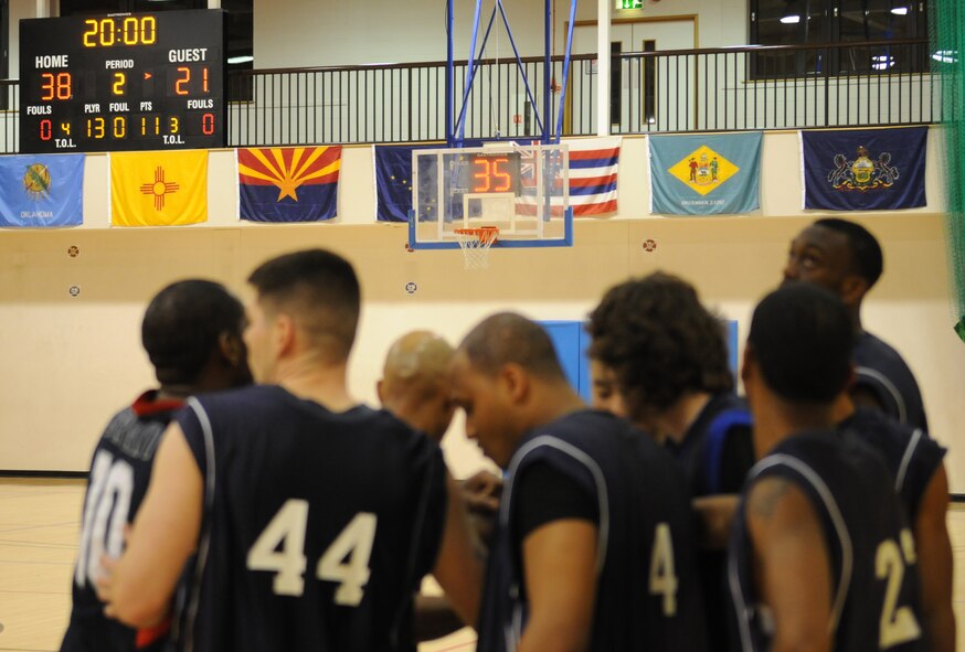 RAF MILDENHALL, England – Down at half time with a score of 38-21, the 488th Intelligence Squadron huddles together with hopes to rally from behind in the second half during the Intramural Basketball Championship game at the Hardstand Gym Feb. 18. IS wasn’t able to come away with the victory, losing to the 100th Maintenance Group with the final score of 61-41, making MXG RAF Mildenhall’s 2010 Intramural Basketball Champions. (U.S. Air Force photo by Staff Sgt. Jerry Fleshman)