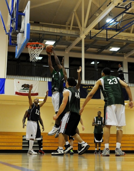 RAF MILDENHALL, England – Jonnie Story, 100th Maintenance Group, dunks the basketball during the  Intramural Basketball Championship game at the Hardstand Gym Feb. 18. (U.S. Air Force photo/ Staff Sgt. Jerry Fleshman)